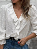 White embroidered V-neck ruffle blouse with bow accents and lace trim sleeves