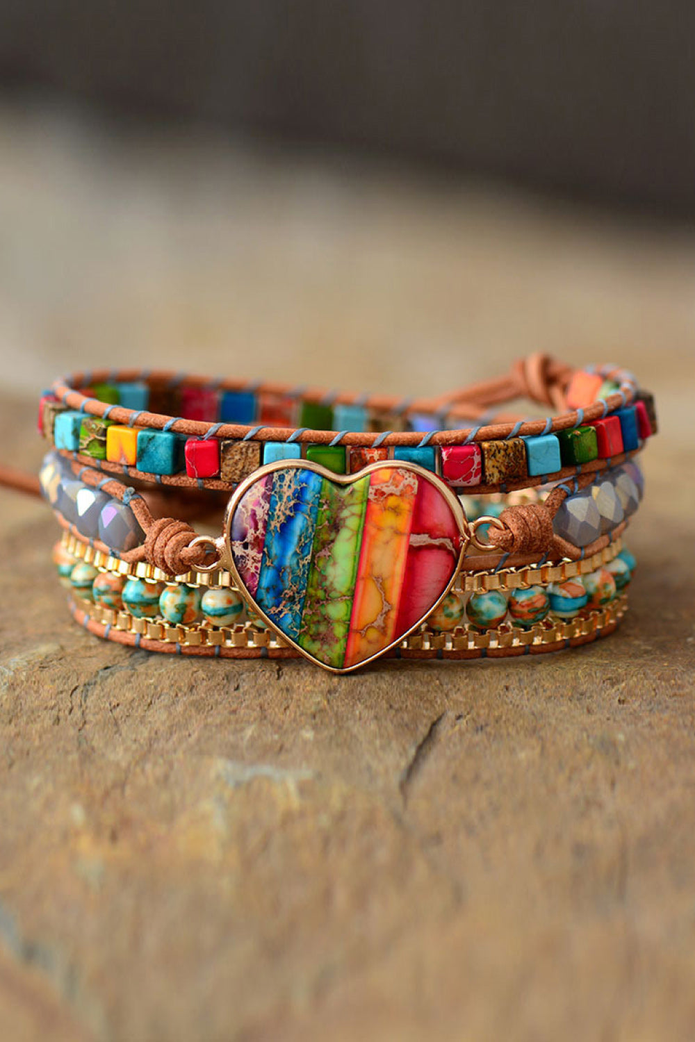 Layered multicolor beaded bracelet with heart pendant and braided leather sides