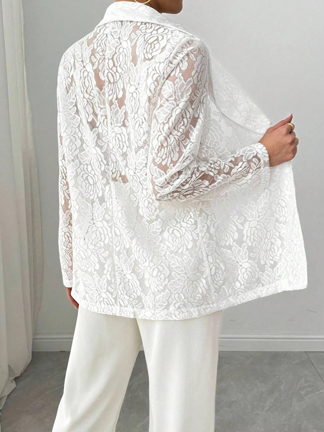 White lace long-sleeve blazer with textured floral pattern, back view