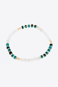 Crystal and natural stone bracelet with white beads and teal accents