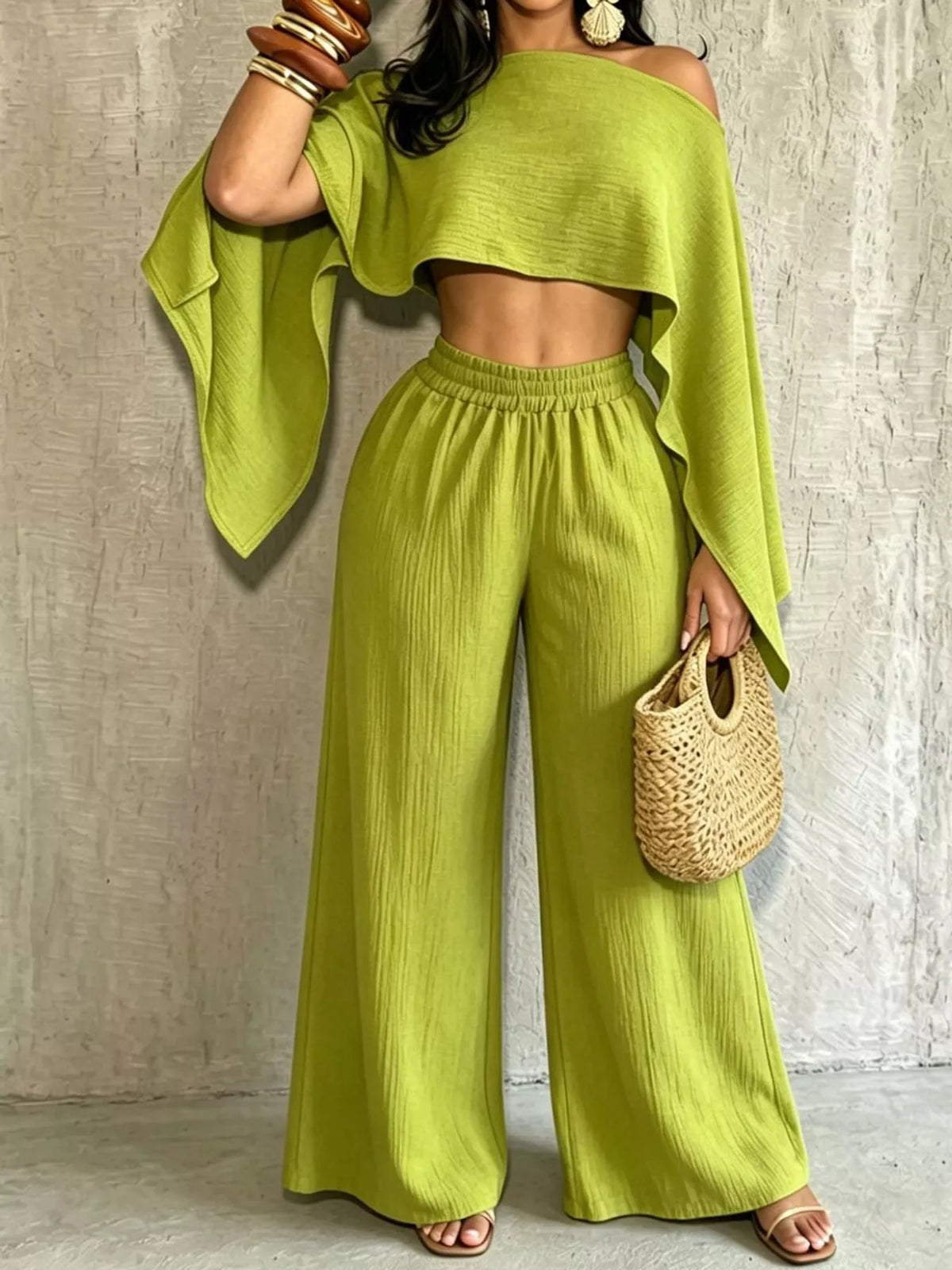 Lime green boat-neck crop top and wide-leg pants set with loose cape sleeves