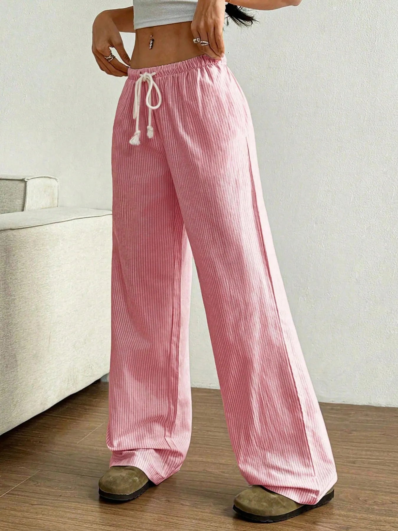 Pink striped wide-leg pants with elastic waistband and white drawstring ties