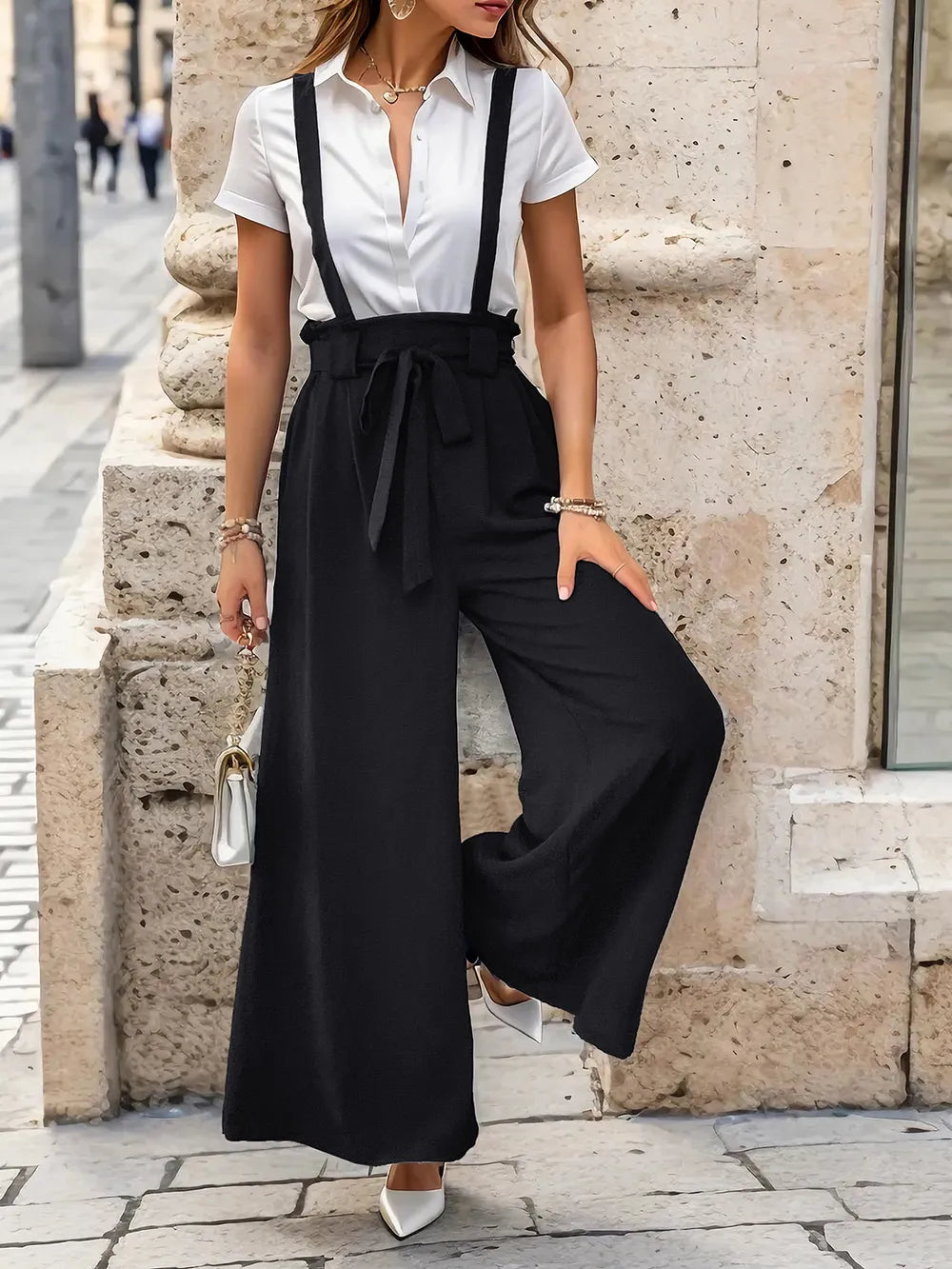 Black wide-leg suspender pants with bow-tied waist and gathered bib front
