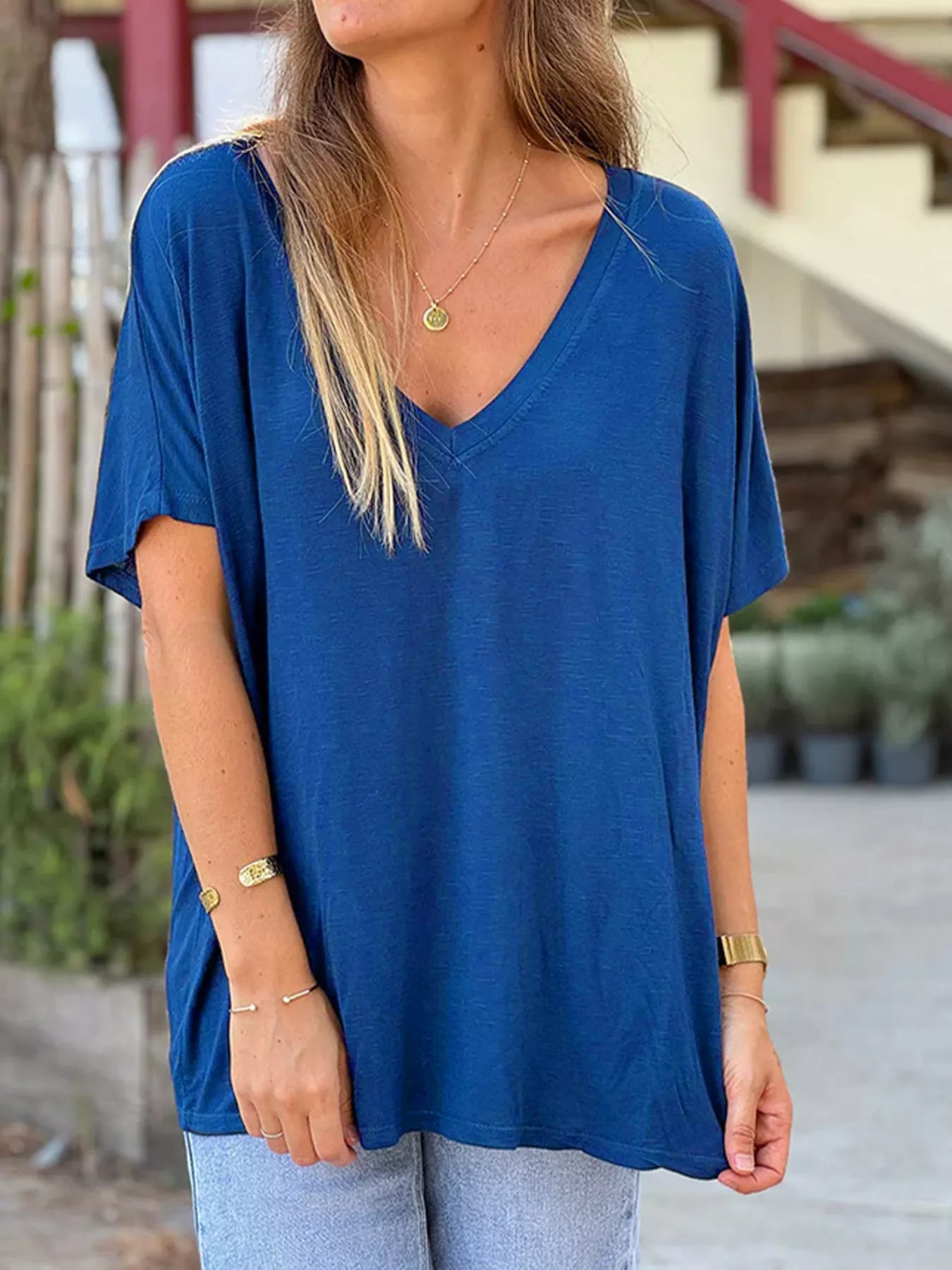 Blue relaxed V-neck T-shirt with short sleeves and loose fit