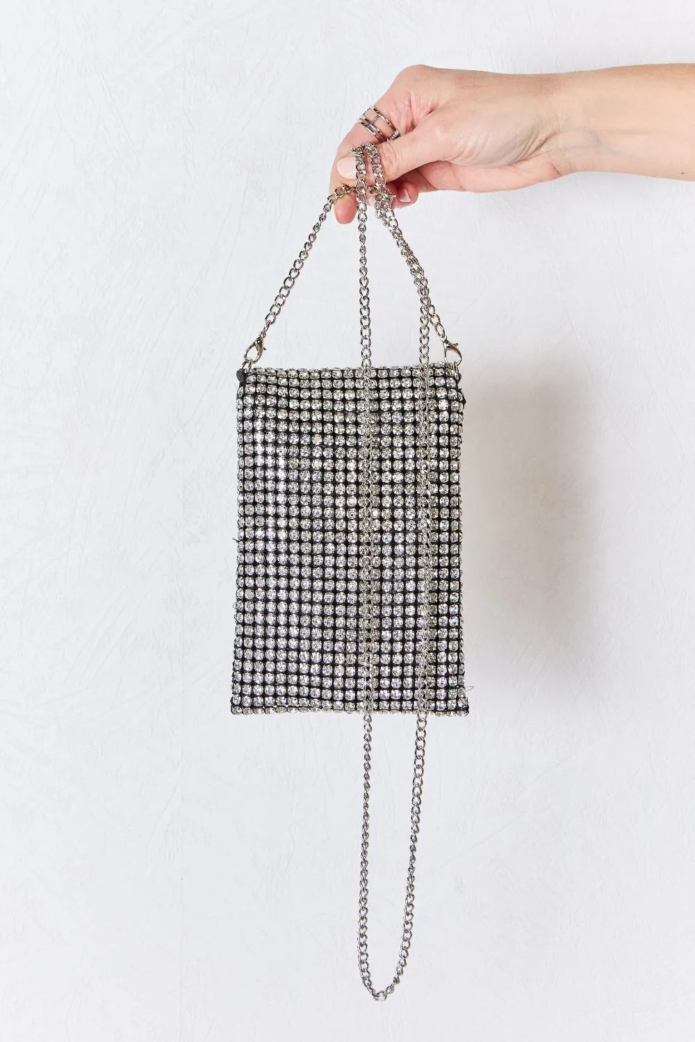 Rhinestone mini crossbody bag with silver chain handles and rectangular all-over shine