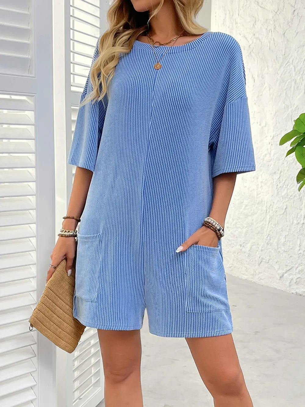 Blue textured striped backless romper with round neck and half sleeves