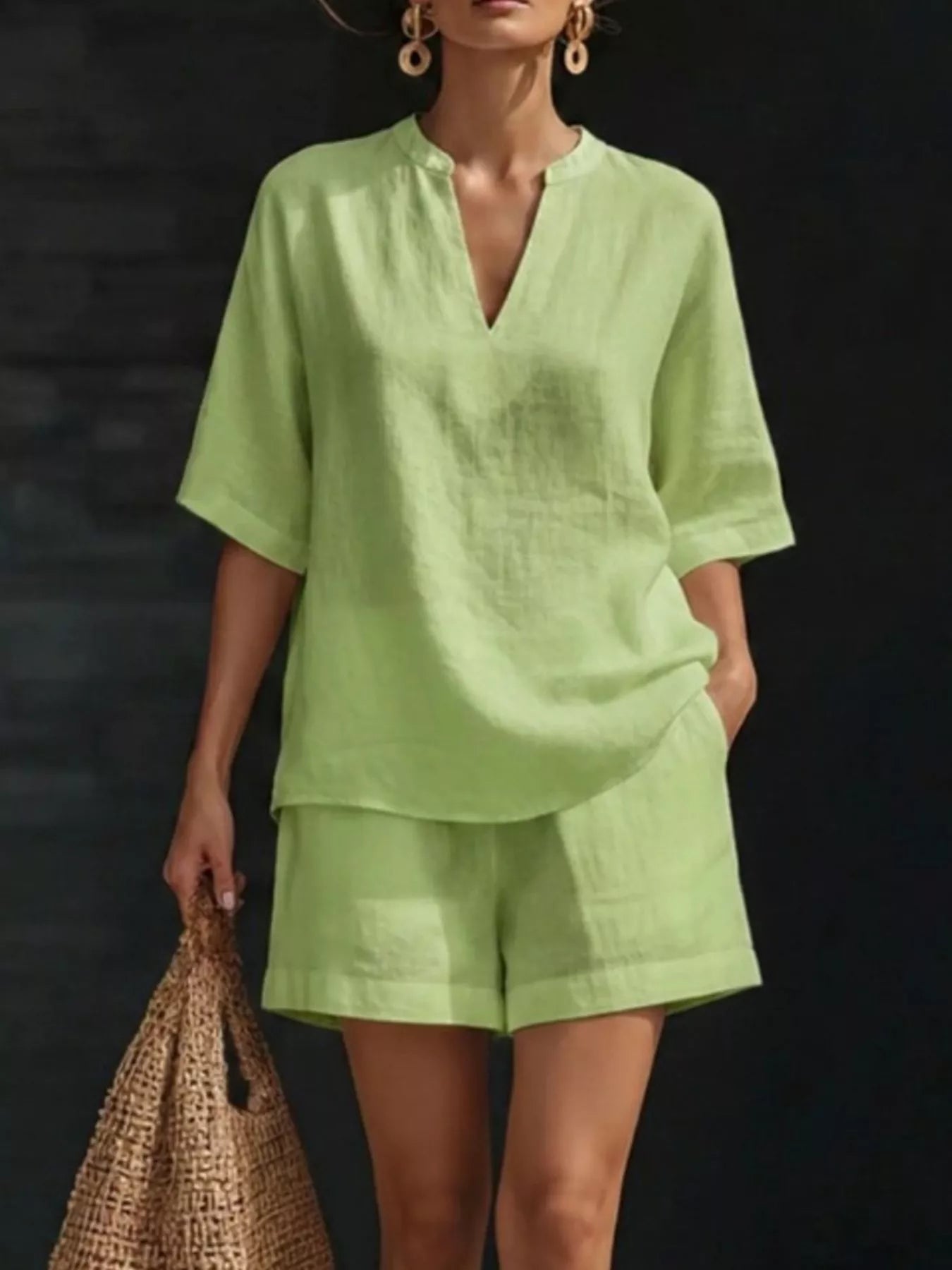 Light green notched V-neck half-sleeve top with matching shorts set, side pouch pocket.