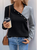 Contrast long-sleeve sweatshirt with decorative buttons, black front and gray sleeves