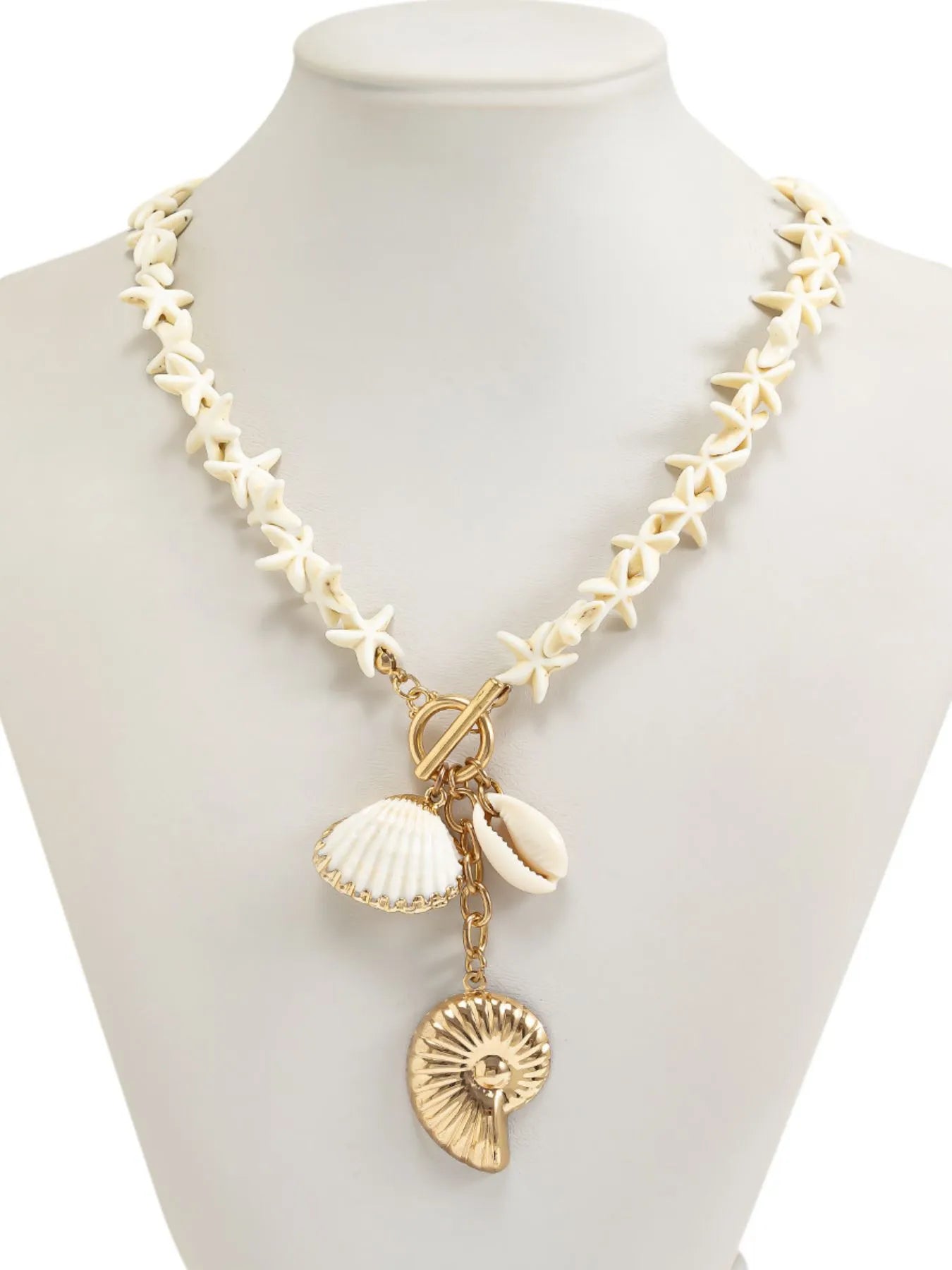 Shell pendant necklace with starfish-shaped links and gold-and-white seashell charms
