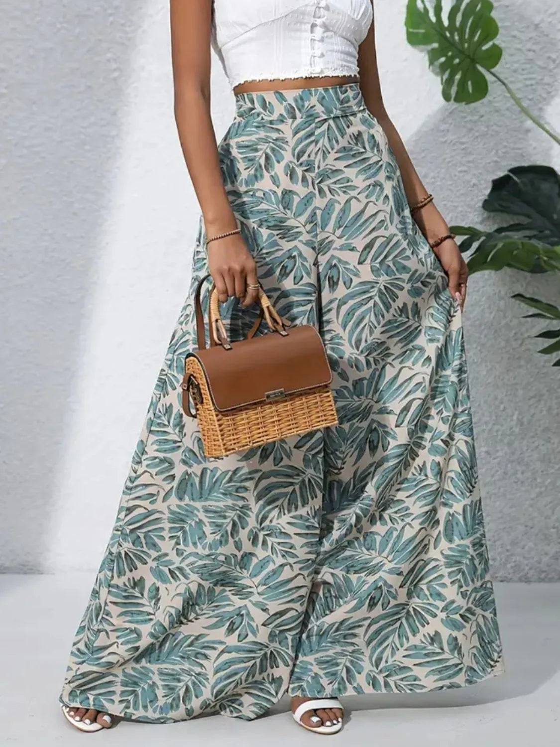 High-waist wide-leg pants in pale teal and cream with scattered leaf pattern