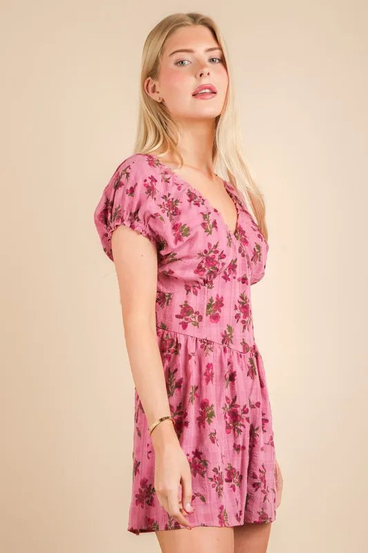 Pink floral printed romper with ruffle sleeves and V-neck, short gathered-waist style