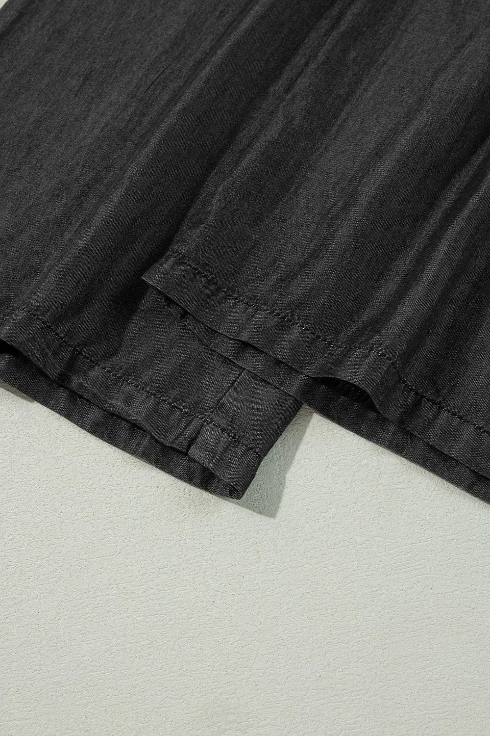 Black wide-leg pants with layered frilled hem