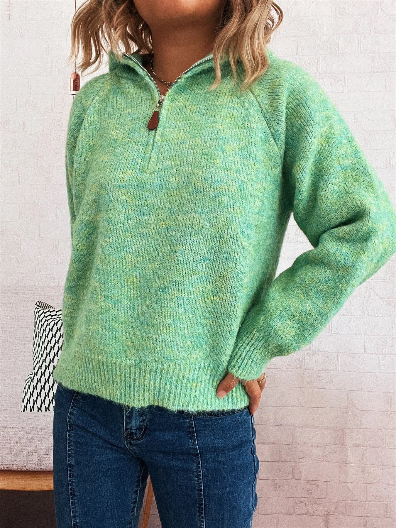 Green quarter-zip sweater with ribbed hem, long sleeves