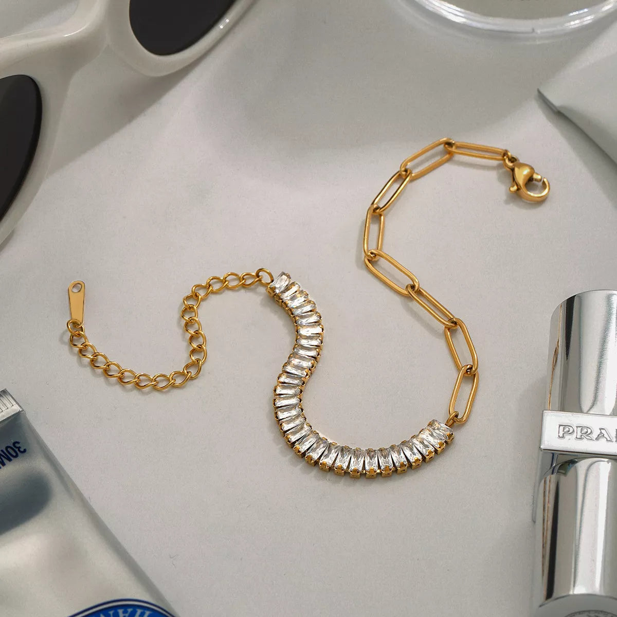 Gold chain bracelet with clear rhinestone row and toggle clasp