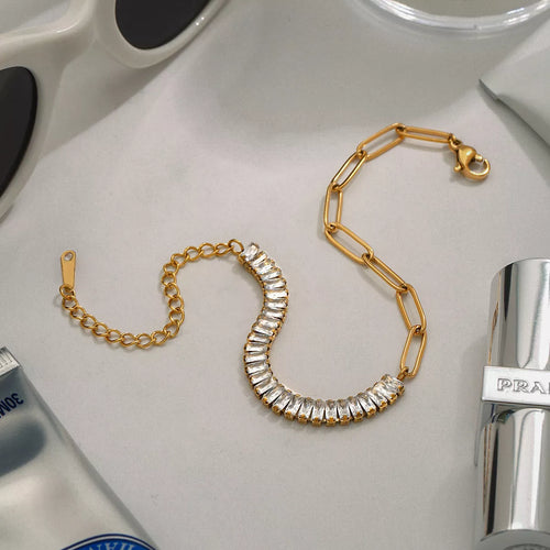 Gold chain bracelet with clear rhinestone row and toggle clasp