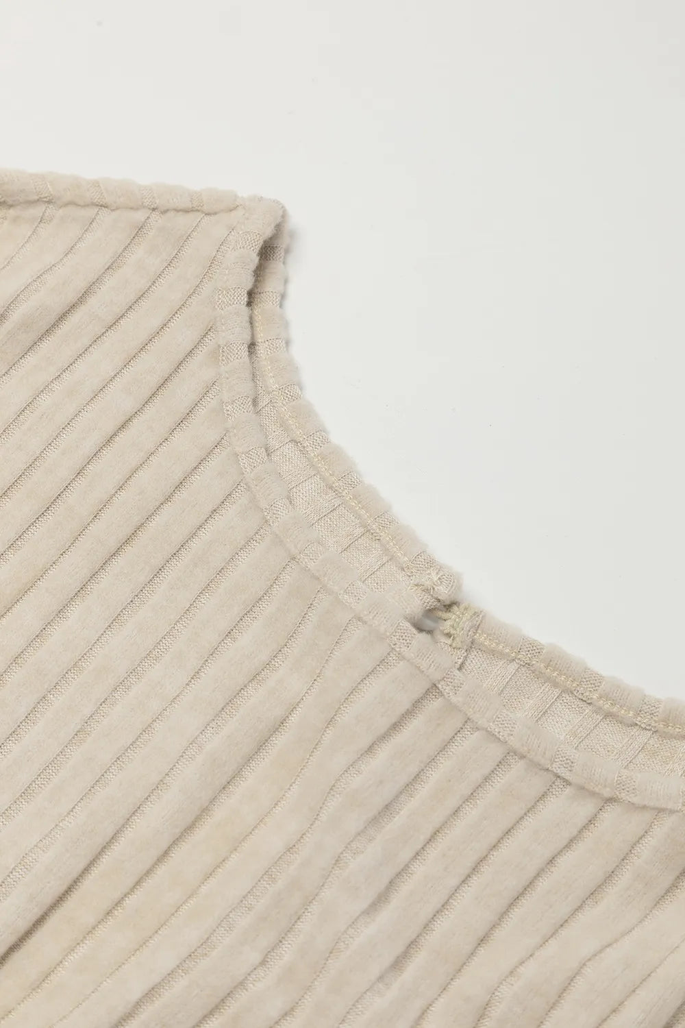 Beige ribbed knit jumpsuit neckline and shoulder yoke detail