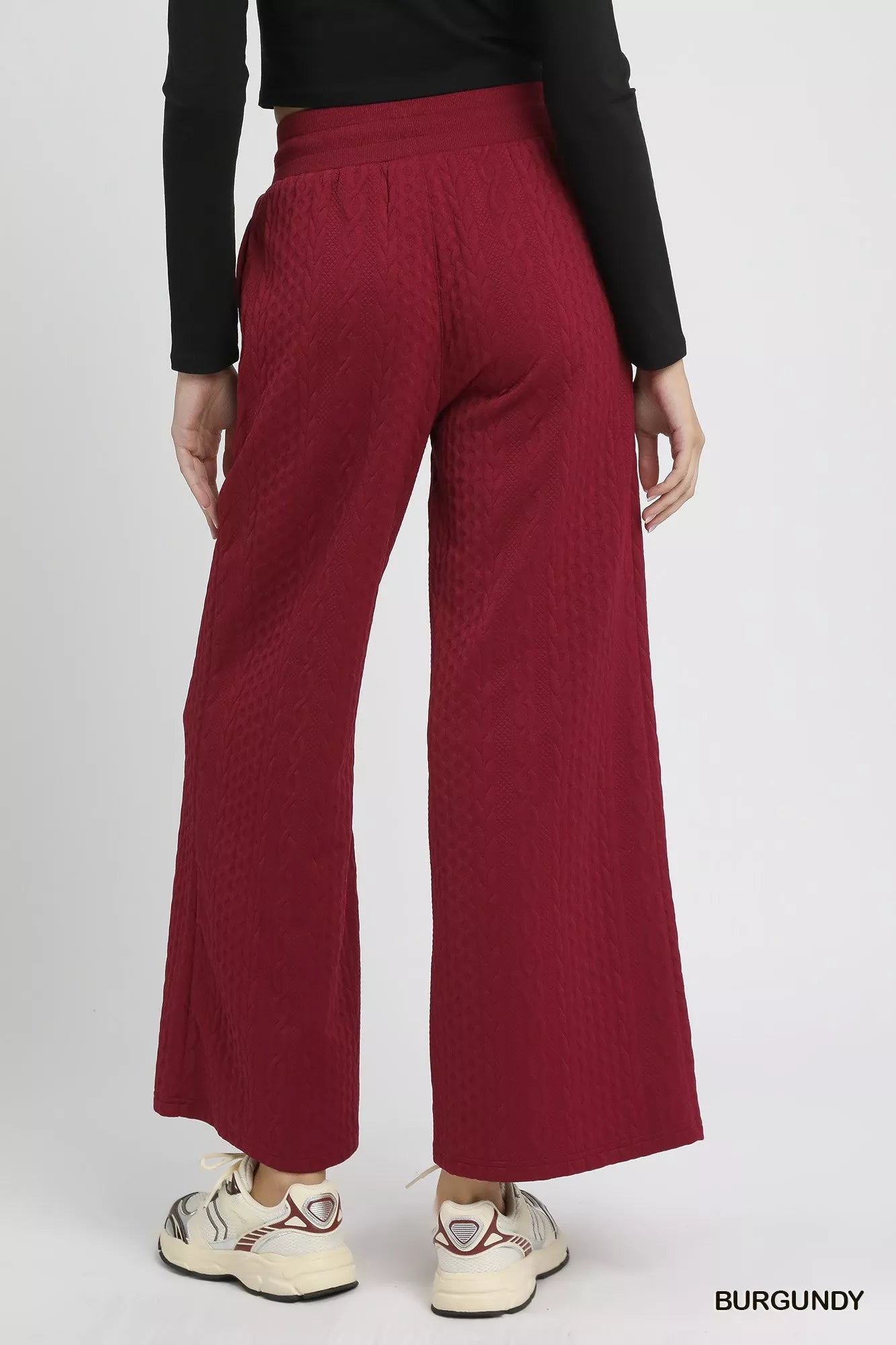 Burgundy wide-leg pants with textured cable-knit pattern and comfortable fit