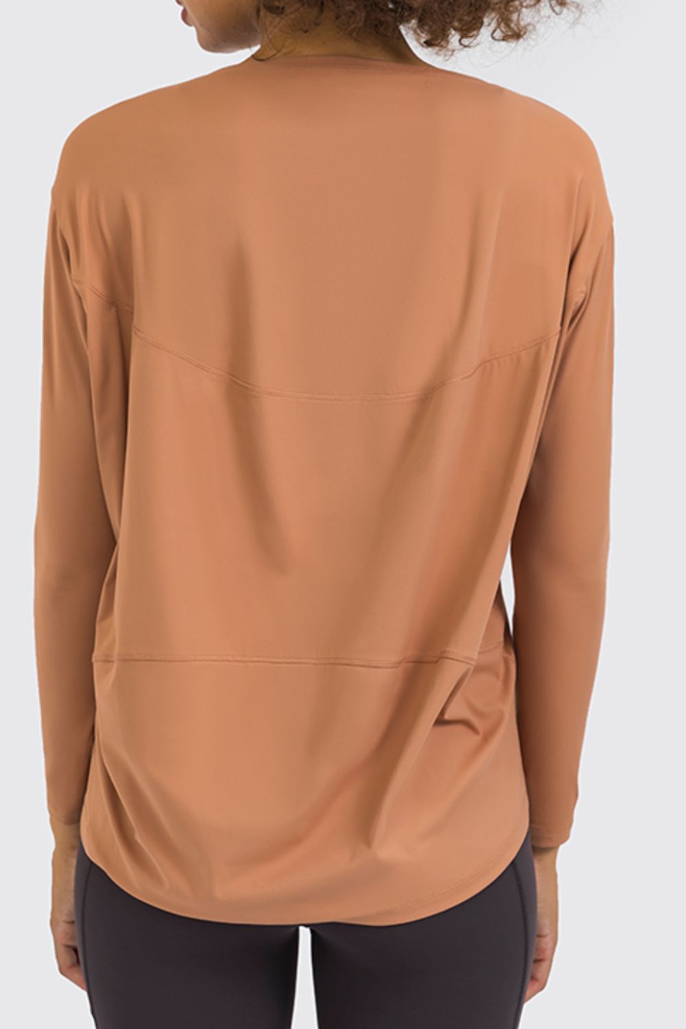 Loose fit active top in tan, back view with long sleeves and relaxed drape.