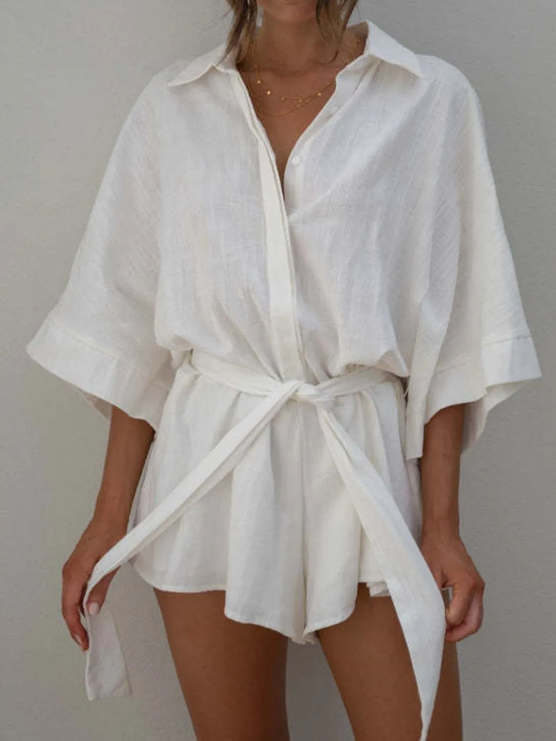White collared romper with loose half sleeves and drawstring waist bow