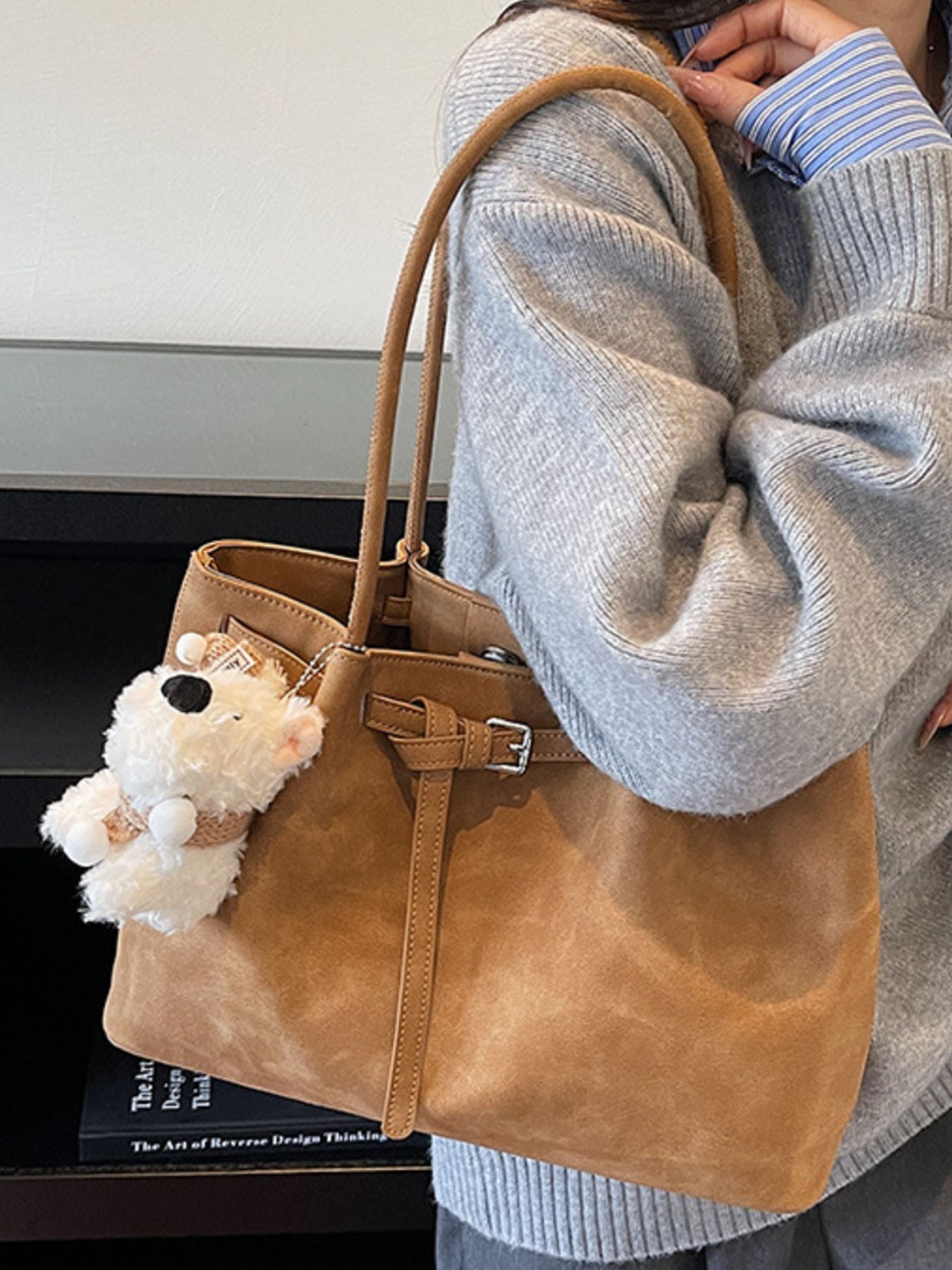 Buckle-detail shoulder bag, medium brown PU with front belt buckle and plush teddy bear keychain