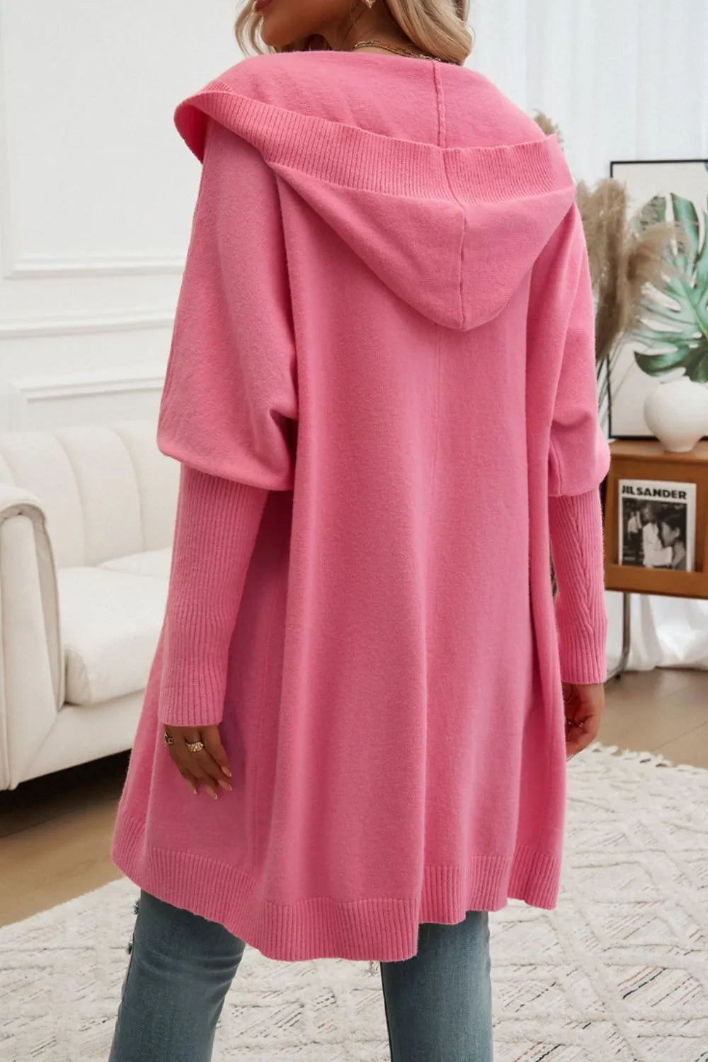 Pink hooded button cardigan, back view with hood and button placket.