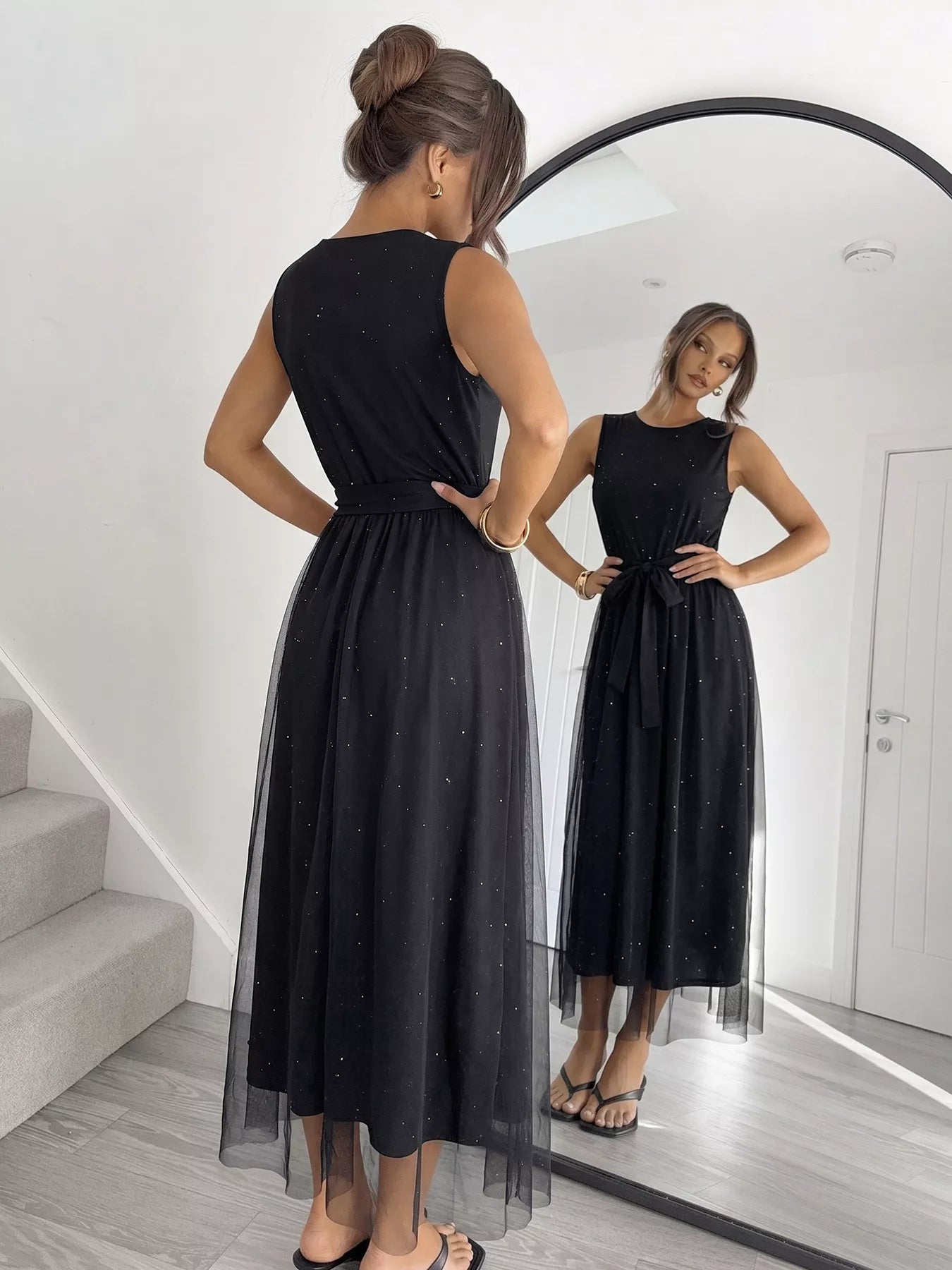 Cedar & Moore Glitter Sleeveless Tulle Midi Dress in black with mesh overlay and a tied waist