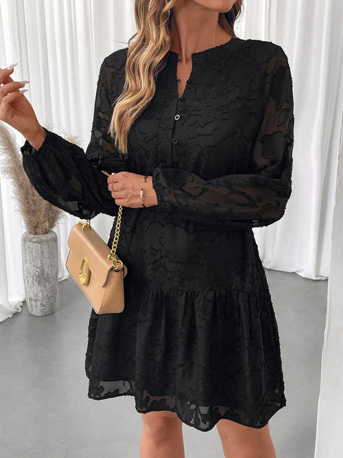 Black button-front mini dress with balloon sleeves, belted waist, and tiered hem