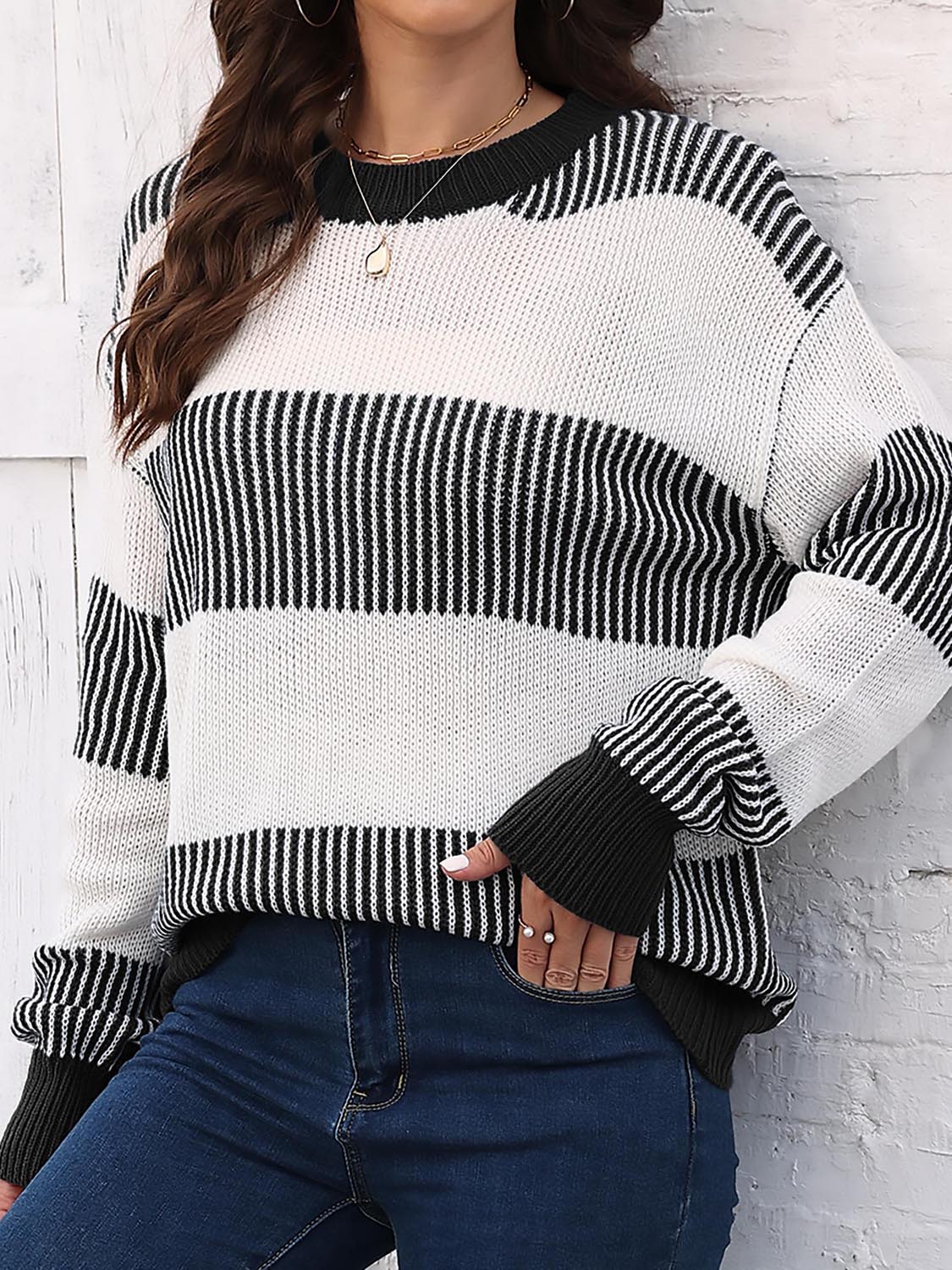 Striped knit sweater with round neck, drop-shoulder long sleeves in black and white