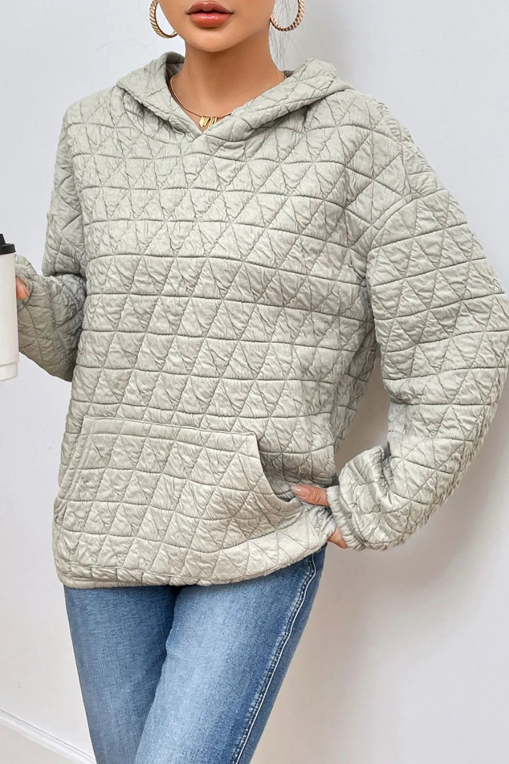 Light gray quilted long-sleeve hoodie with hood and kangaroo front pocket