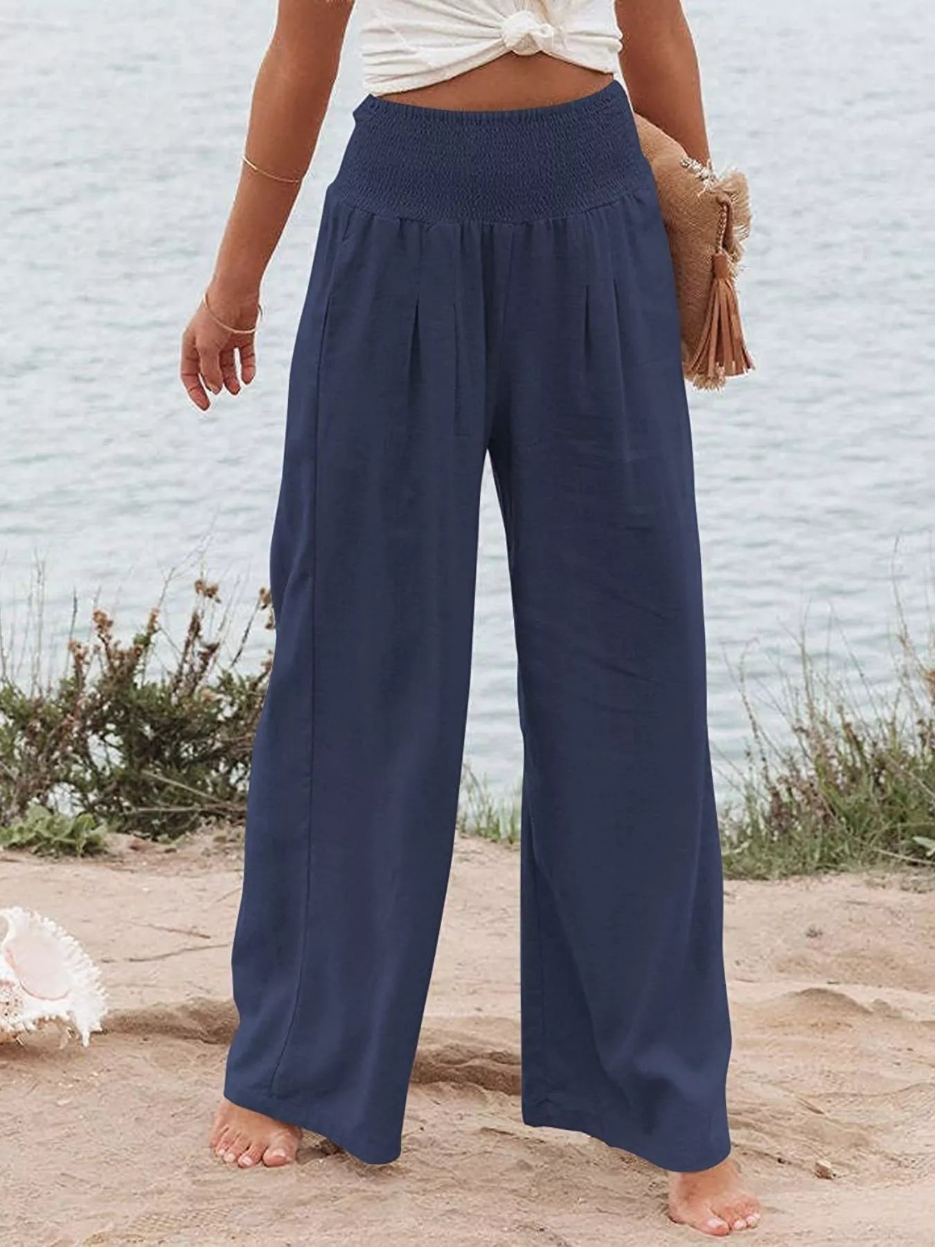 Navy smocked high-waist wide-leg pants with gathered waistband and wide legs