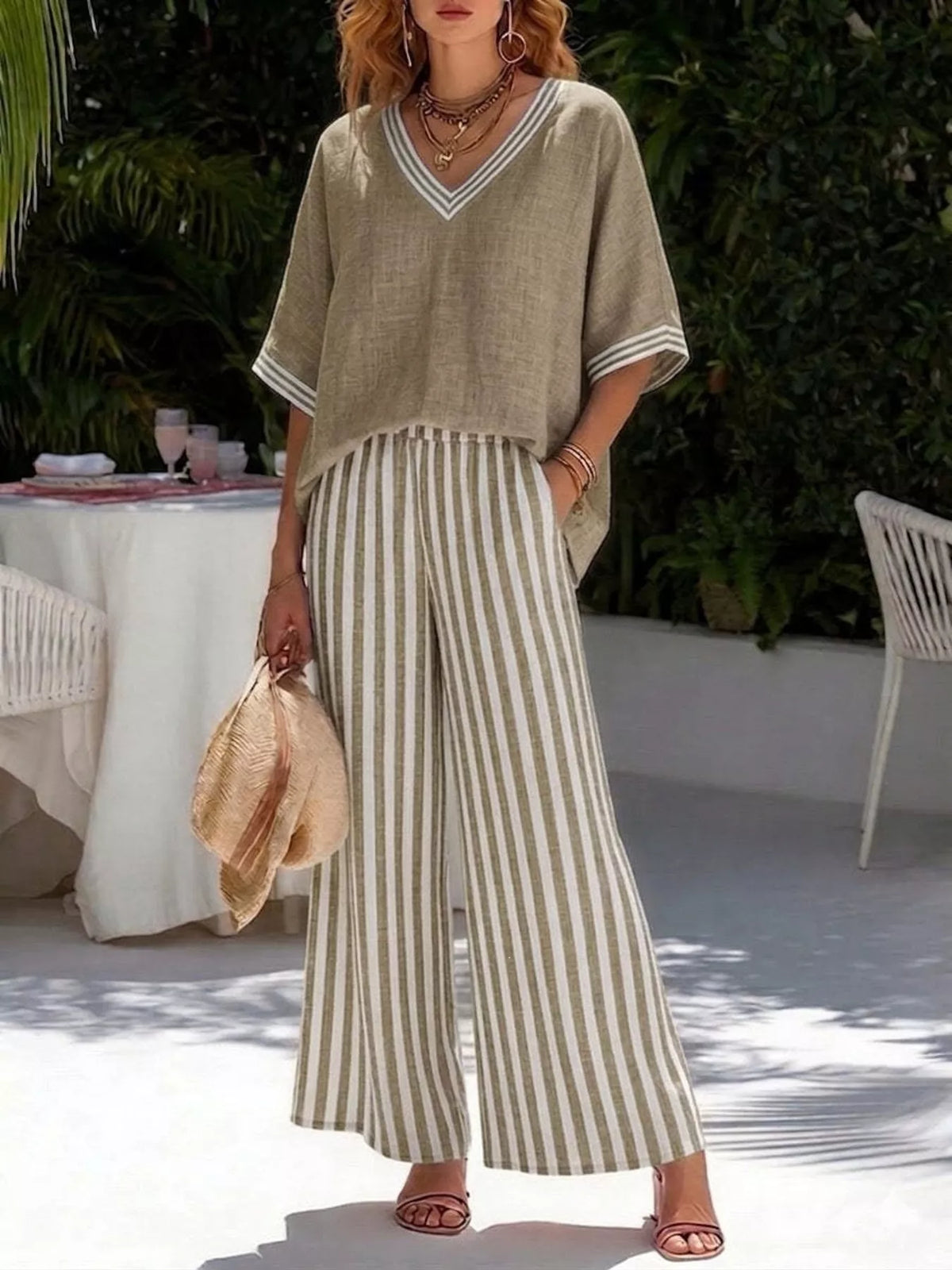 Khaki V-neck loose top with striped wide-leg pants, two-piece casual set.