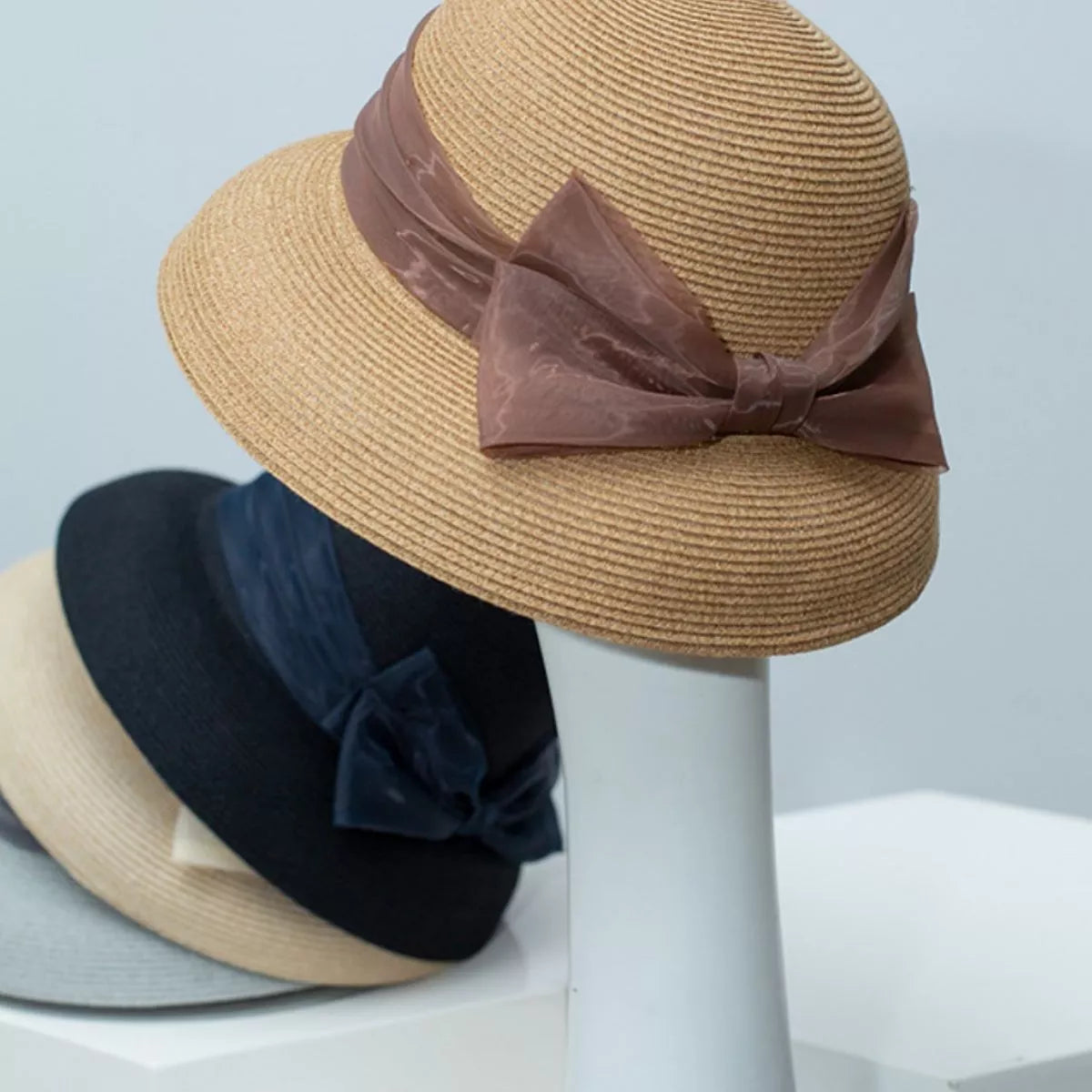 Cedar & Moore Ribbon Bow Straw Sun Hat in tan straw with brown bow