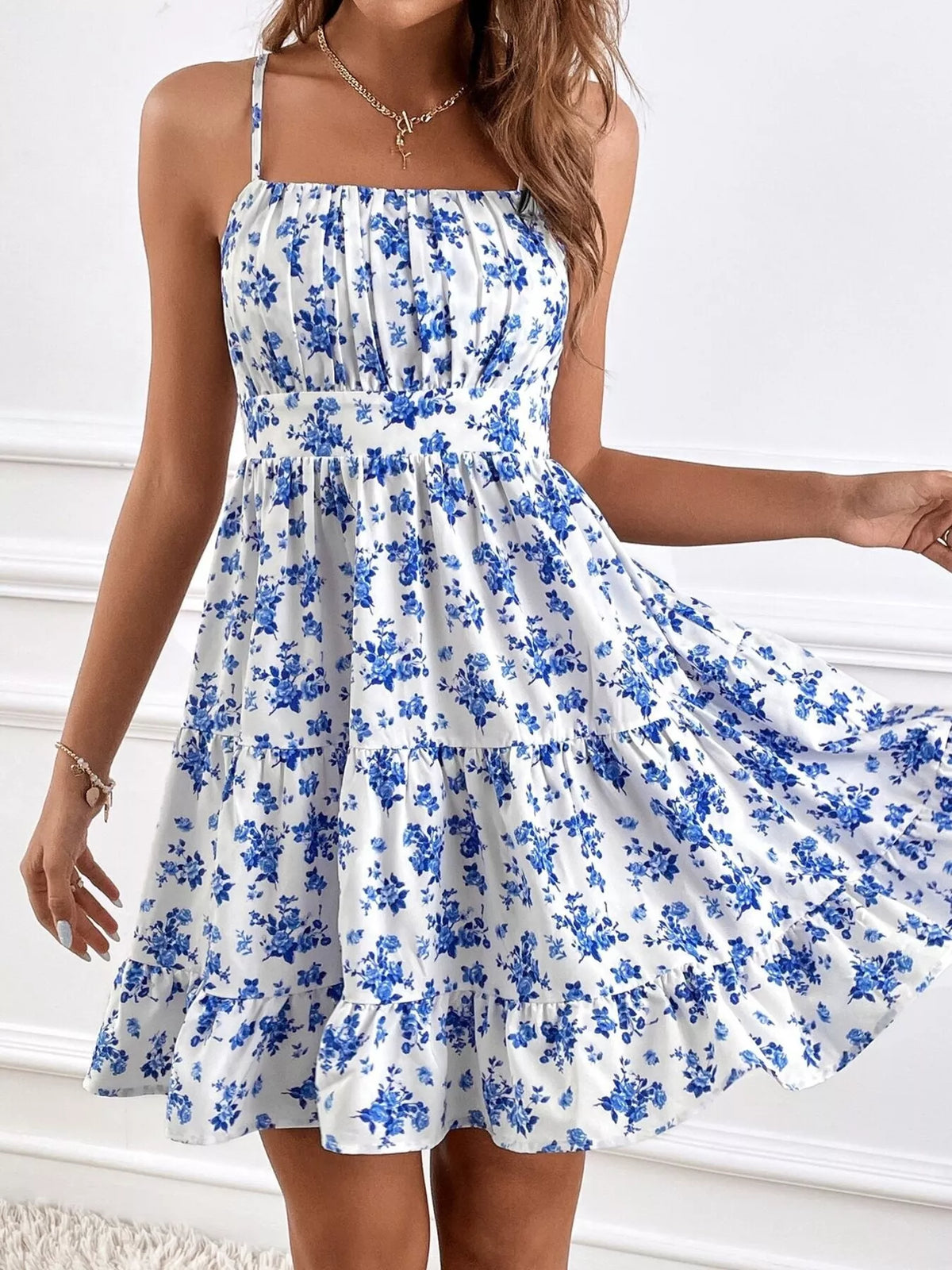 Sky blue floral mini dress with spaghetti straps, square neckline, tiered ruffle skirt