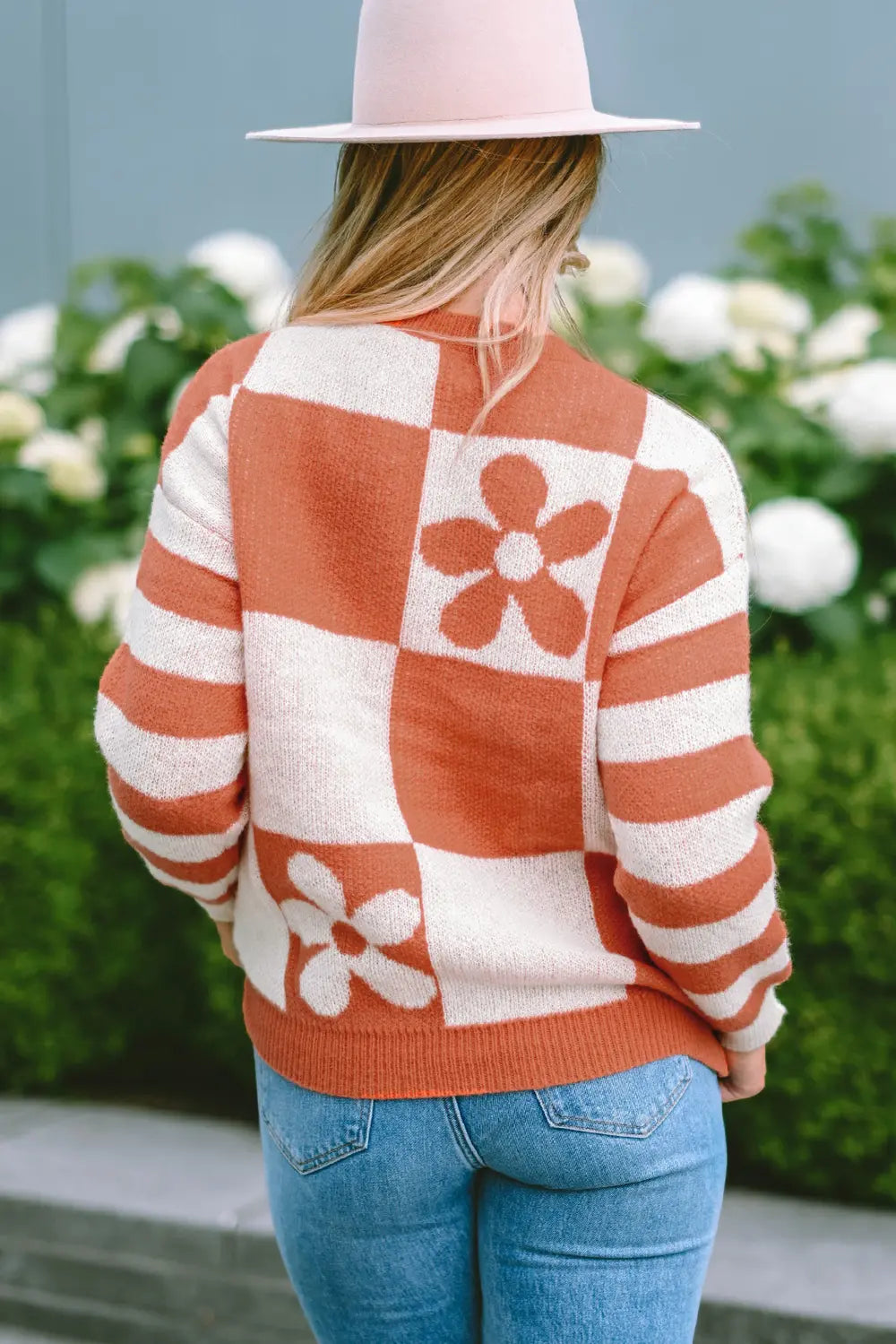 Back view of caramel and cream contrast round neck long sleeve sweater with checker flower design