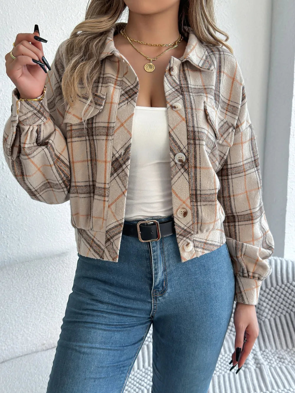 Beige plaid button-up long sleeve jacket with snap buttons and chest pockets