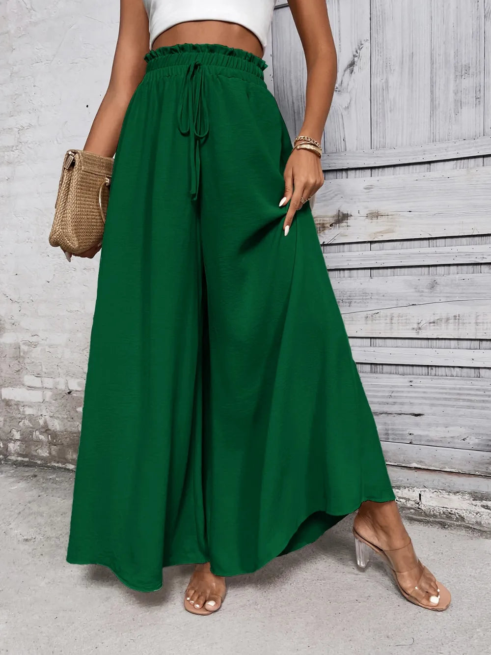 High-waist wide-leg pants in emerald green with drawstring tie at the elastic waist