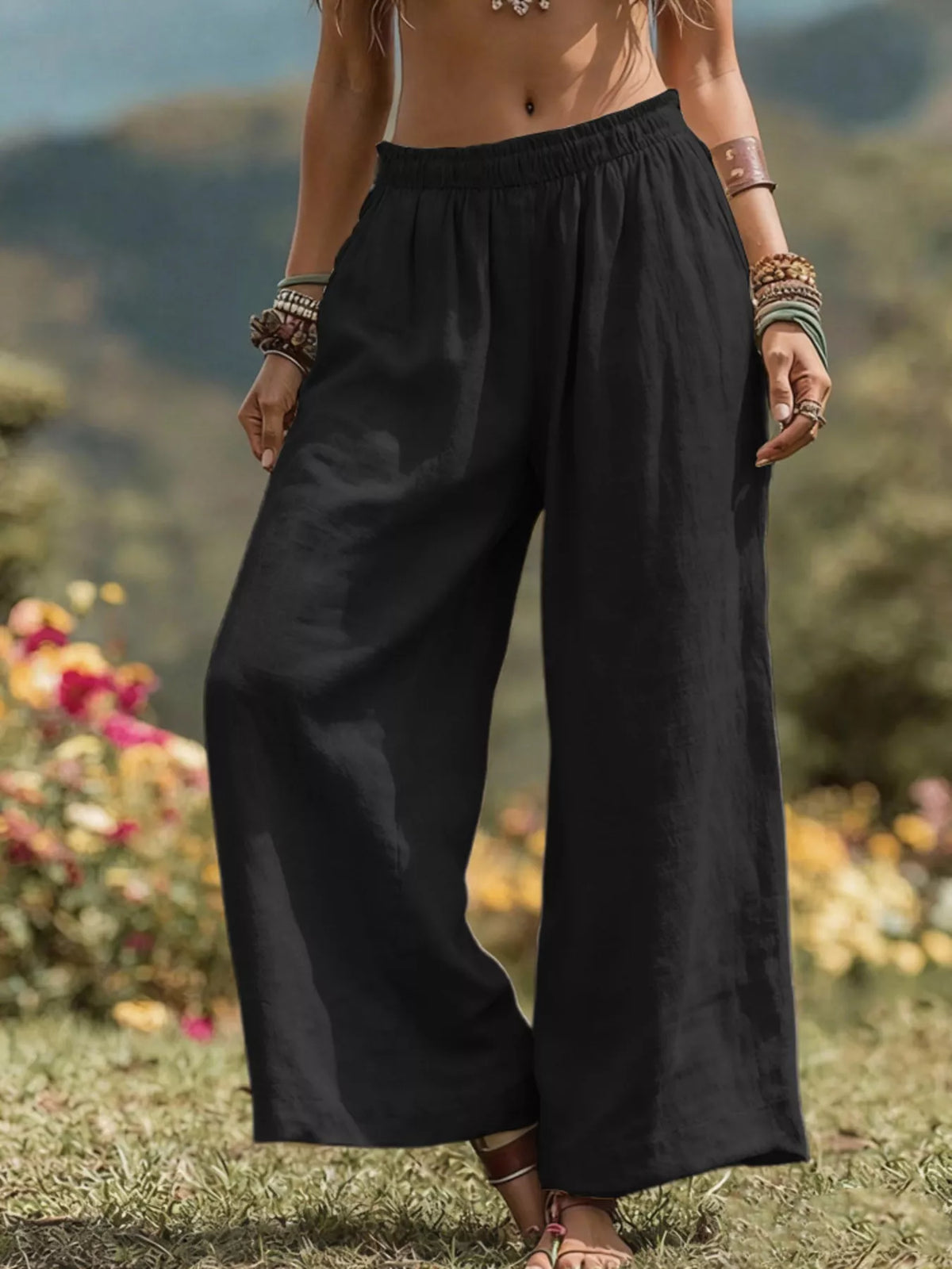 Black bohemian wide-leg pants with elastic waistband and loose, flowy wide legs