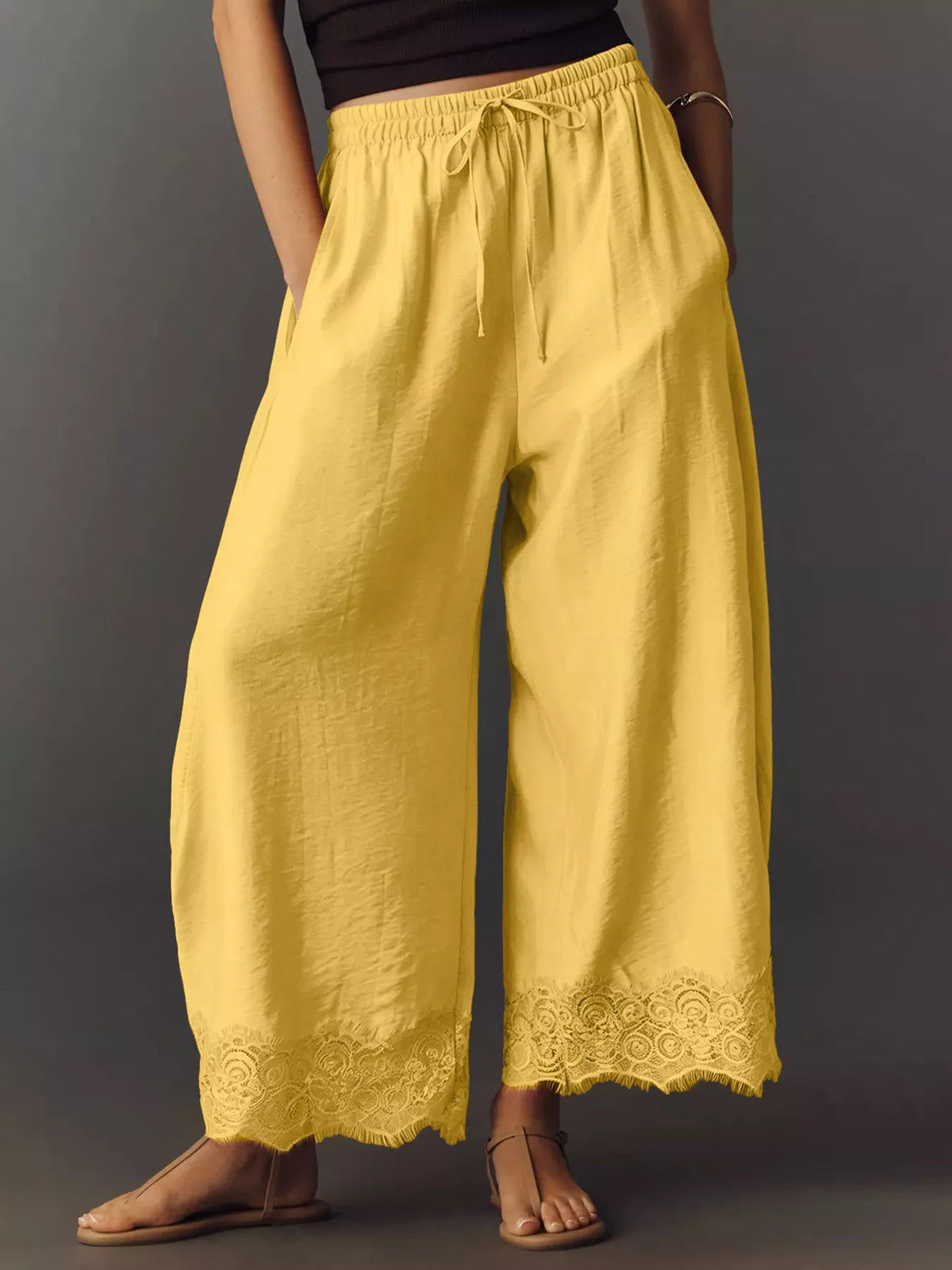 Yellow wide-leg drawstring pants with lace-trim hem