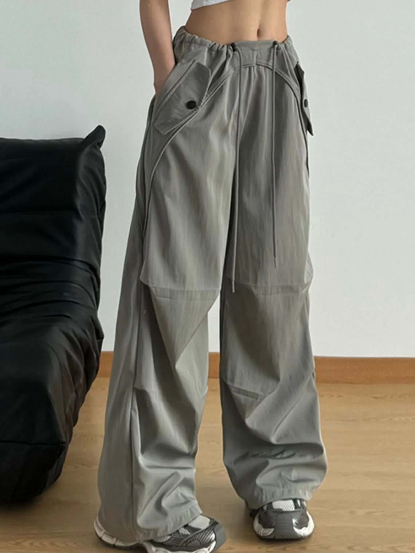 Sage wide-leg drawstring pants with front button detail and side pockets