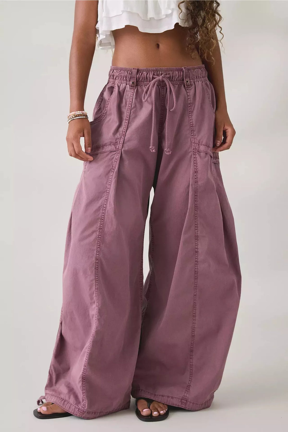 Purple high-waisted cargo wide-leg pants with drawstring waist and side cargo pockets