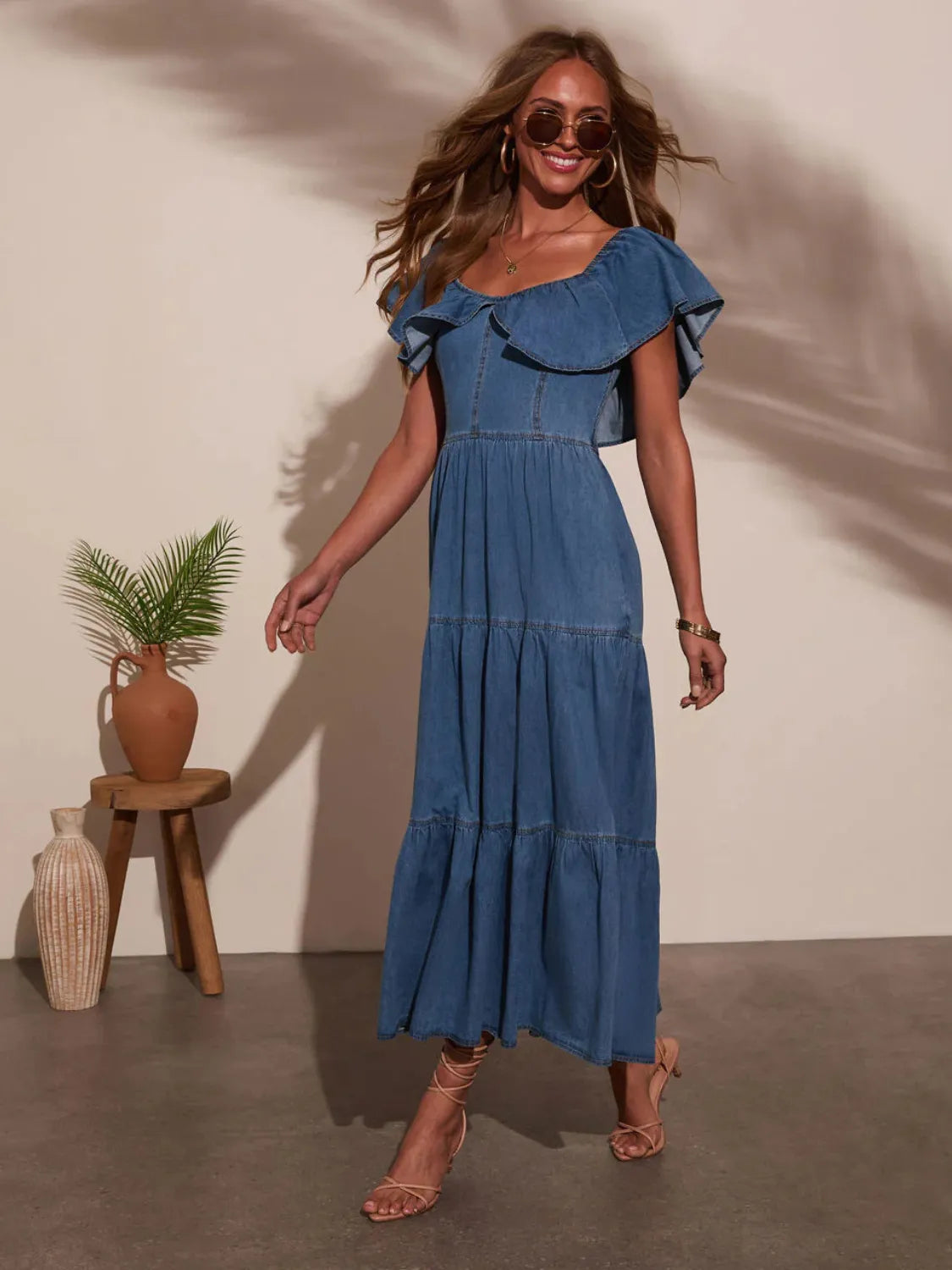 Dark blue off-shoulder tiered denim midi dress with layered ruffles at bodice and hem