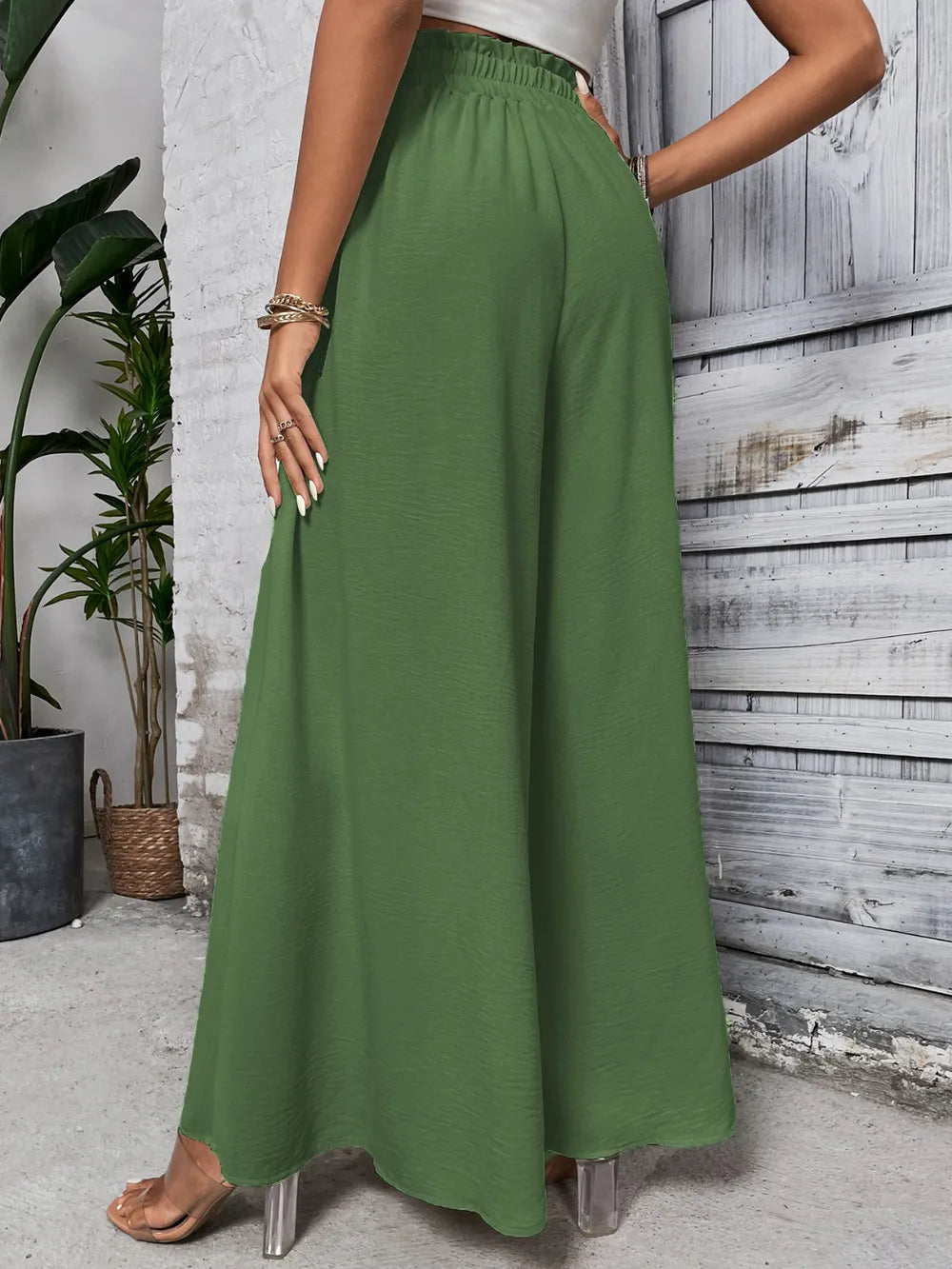 High-waist wide-leg pants in dark green with elastic waistband and drawstring tie