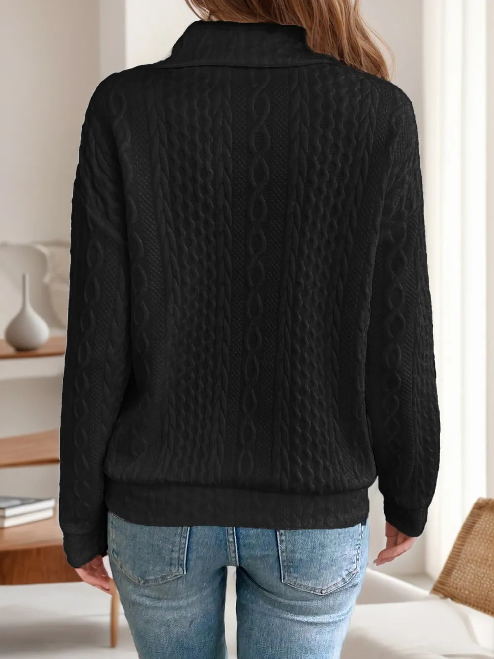 Black long-sleeve sweatshirt back with collared neck and diagonal zipper detail