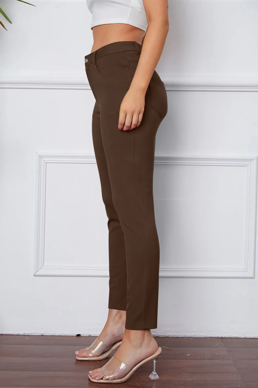 Mocha brown slim ankle pants with belt loops, front button, and side pockets