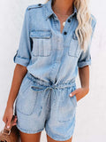 Light blue denim romper with button-up front, half sleeves, chest pockets, drawstring waist