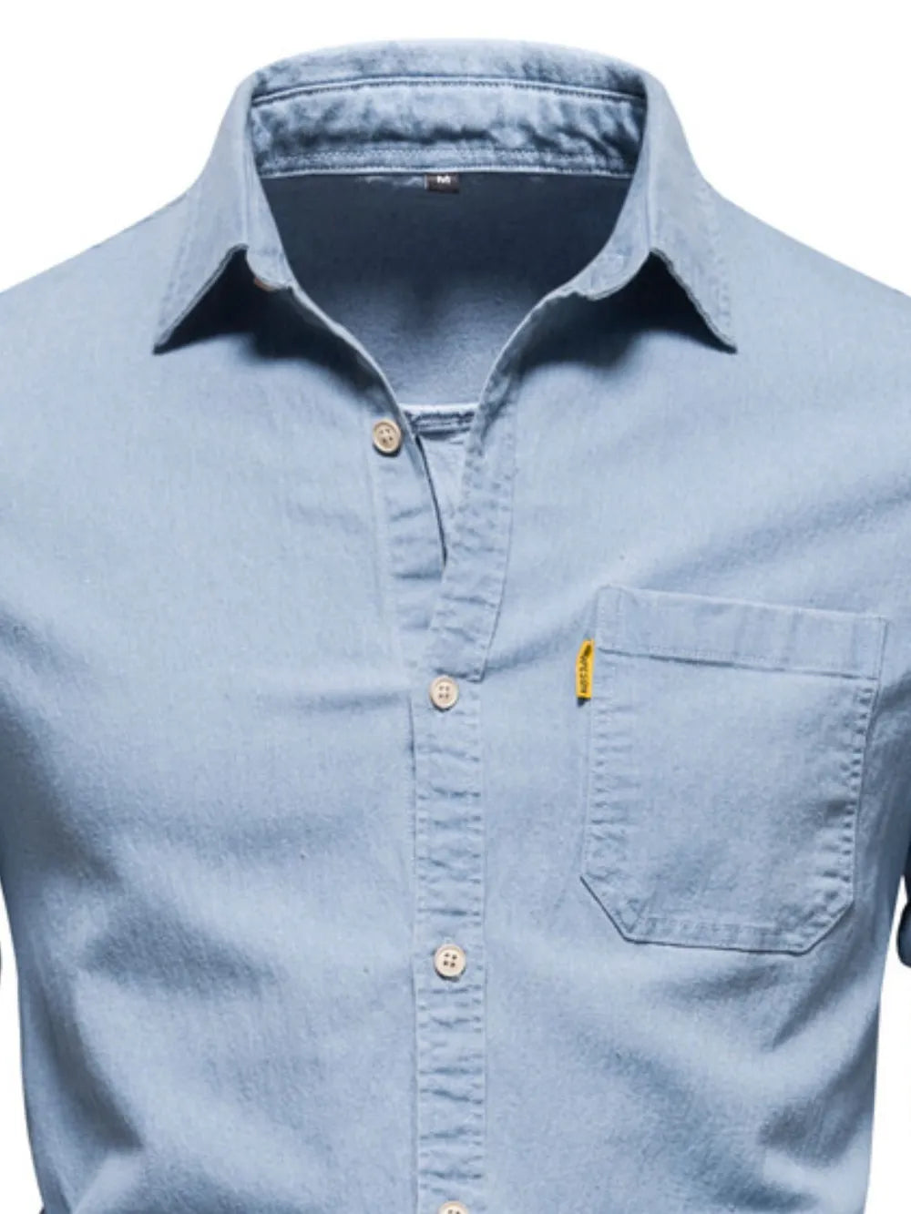 Men's light blue denim button-up shirt front view with pocket
