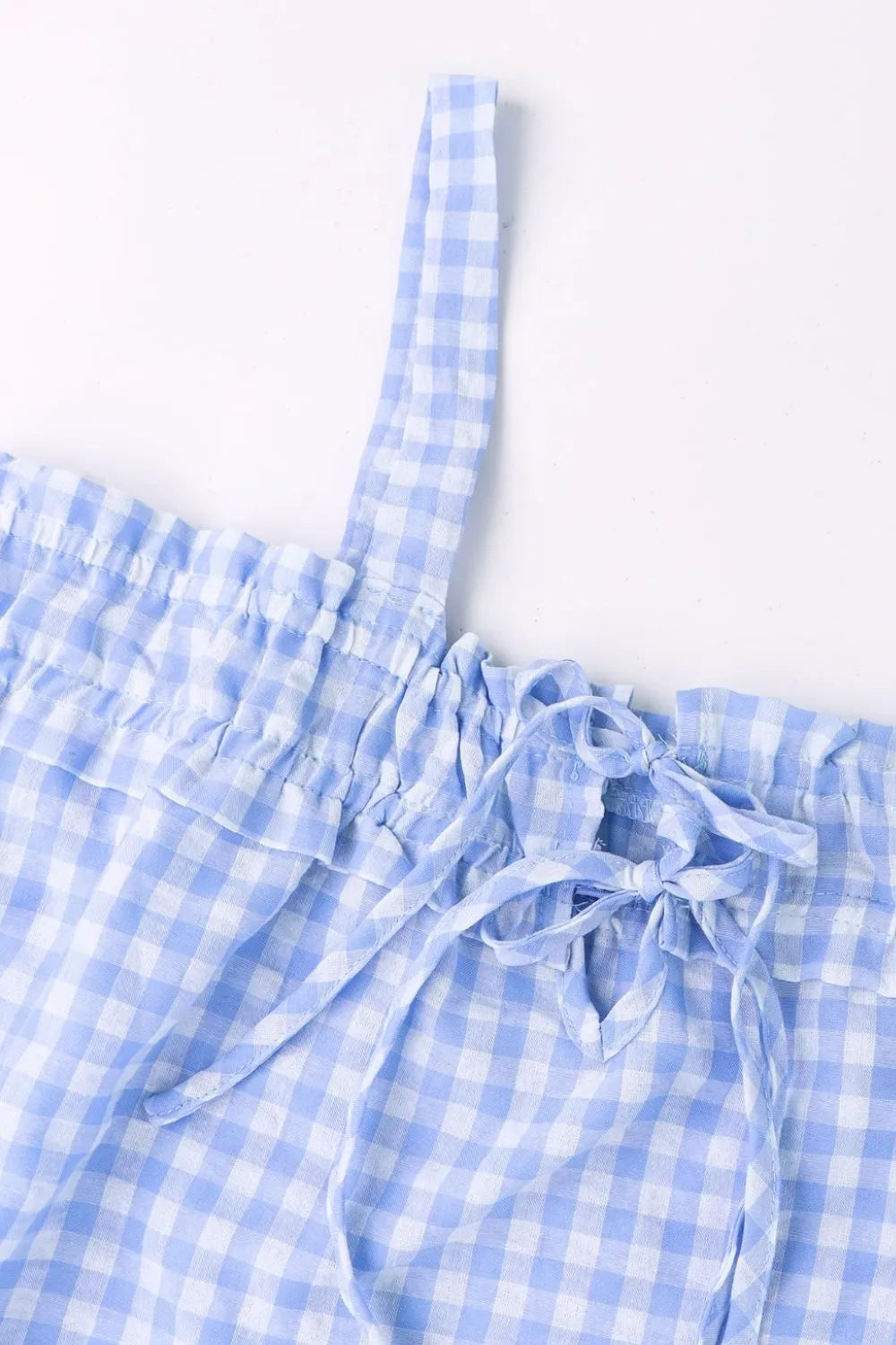 Light blue gingham square-neck cami with tied front bow and ruffled bust