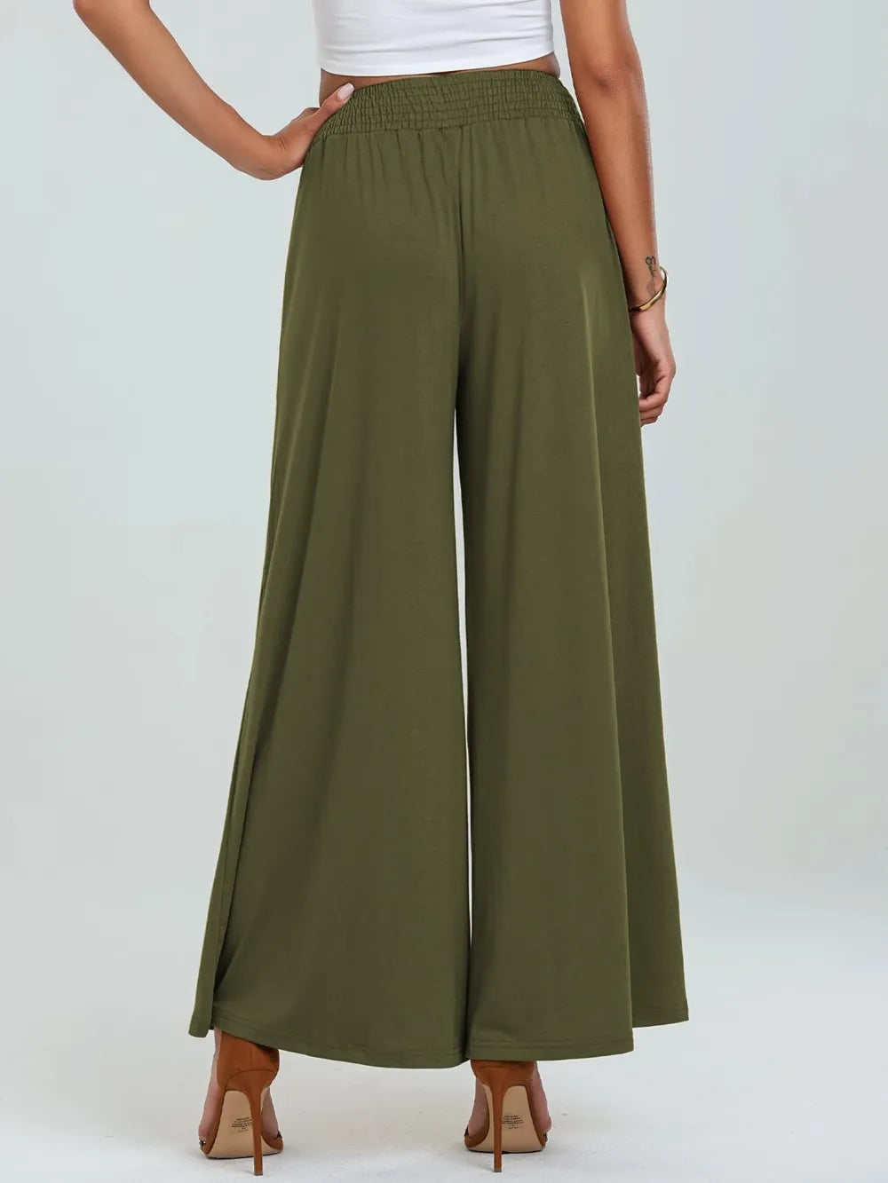 Moss green wide-leg pants with elastic waist and side pockets, full back view