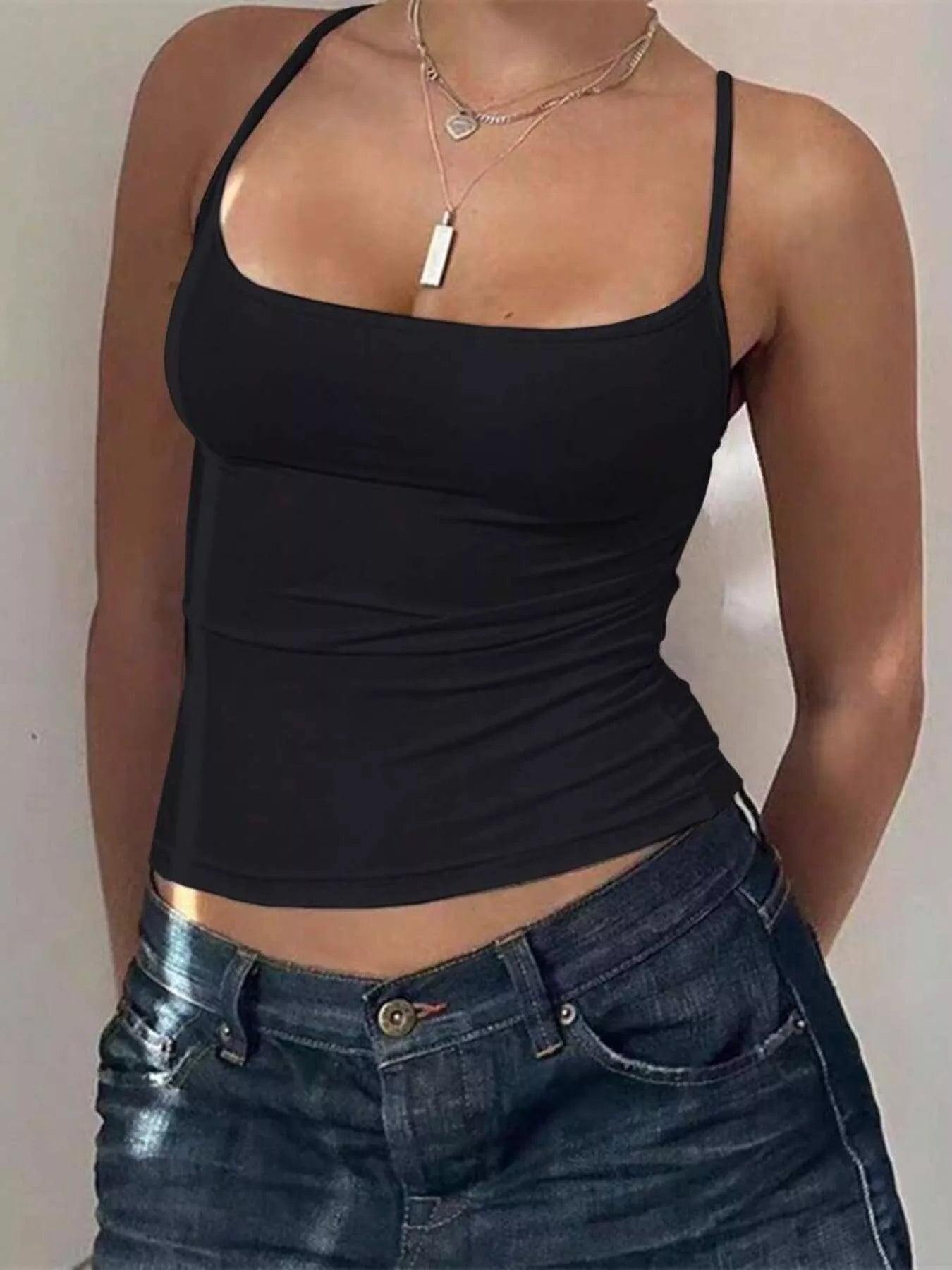 Black scoop neck cami with spaghetti straps and ruched waist, fitted length hem.