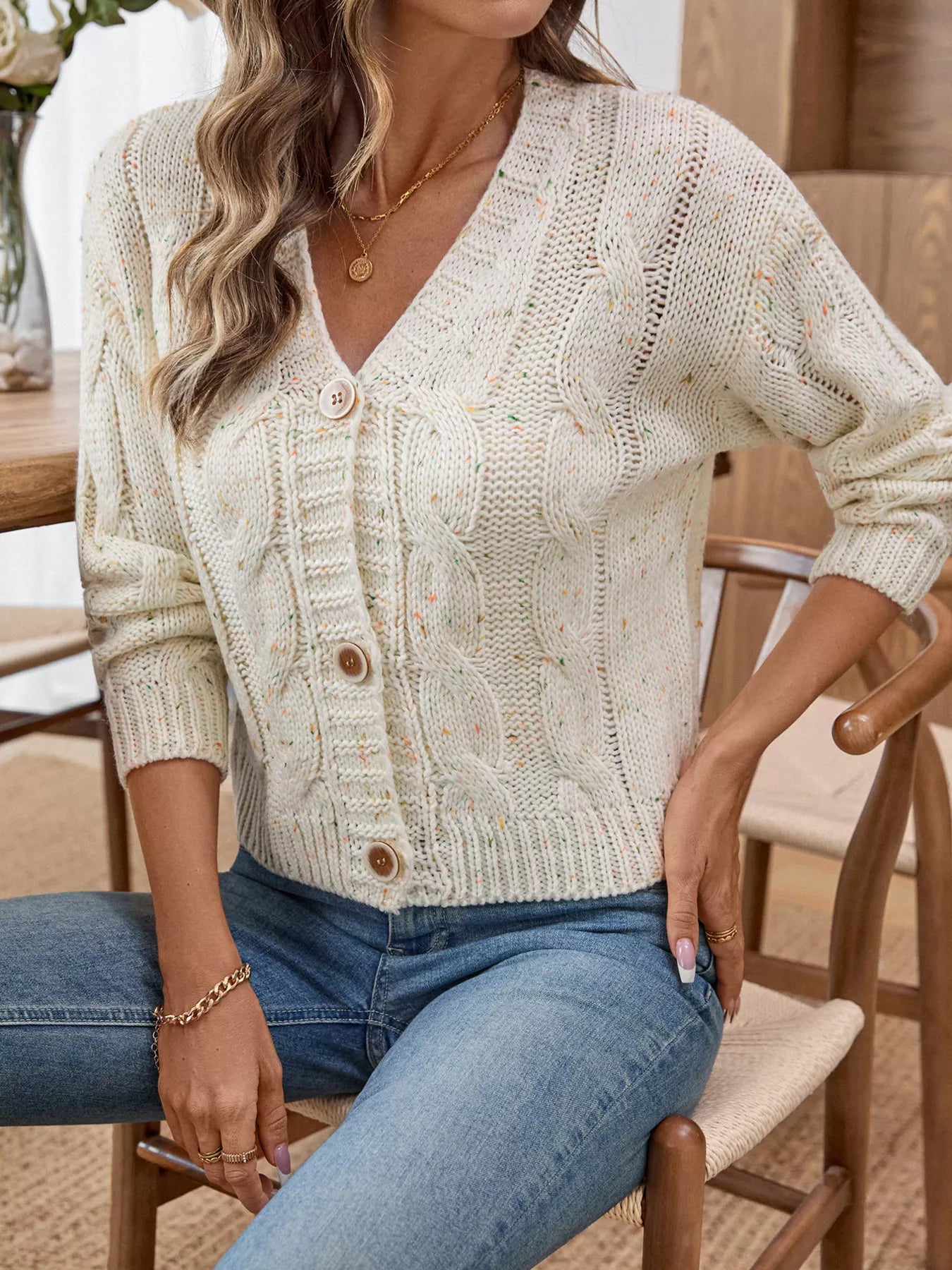 Beige cable knit button-up cardigan with V-neck and button front, long sleeves